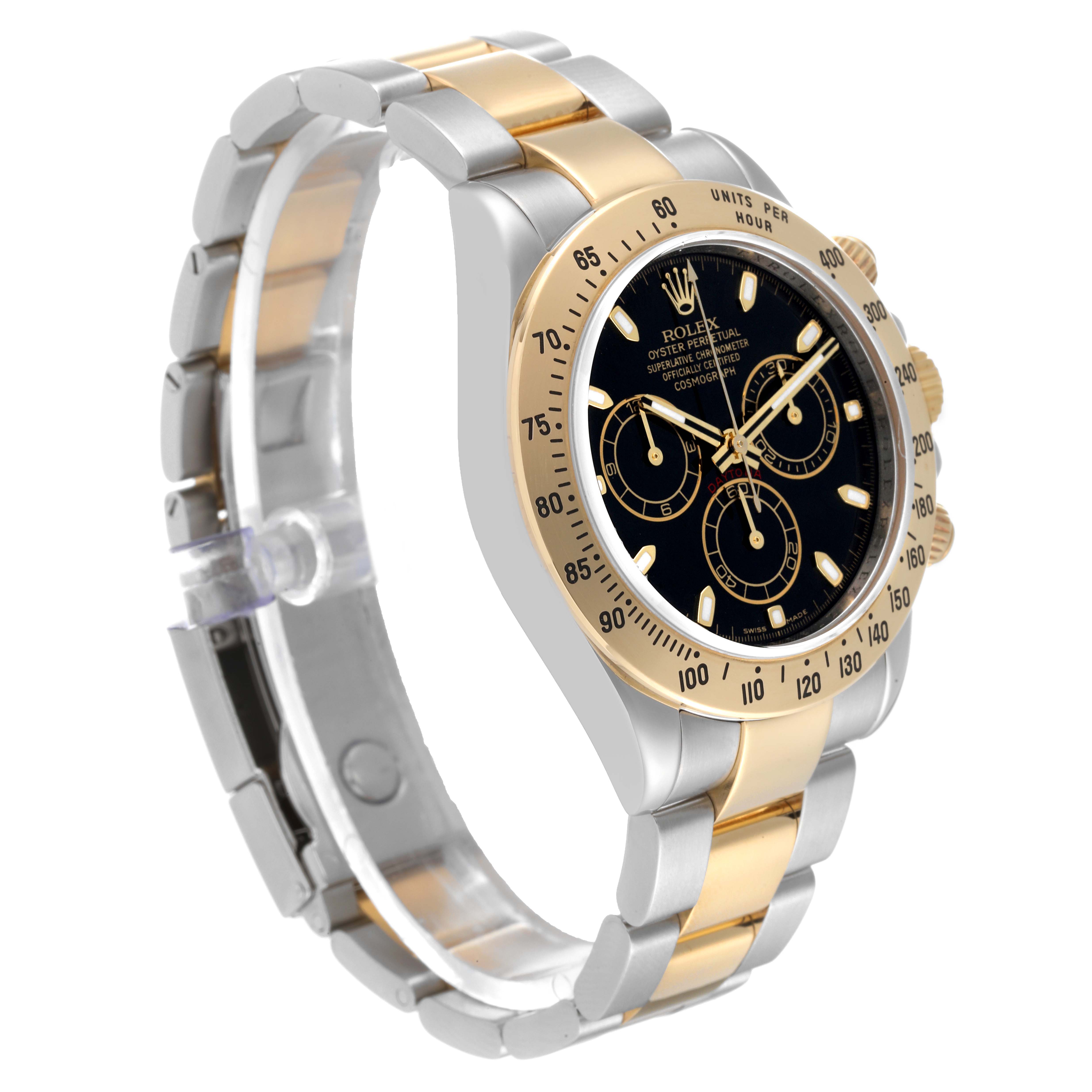 The Rolex Daytona 116523 Men
s Steel and Gold (two tone) Black Dial 116523 Men
s Steel and Gold (two tone) Black Dial watch is shown from a front-left angle, highlighting its bezel, dial, and two-tone bracelet.