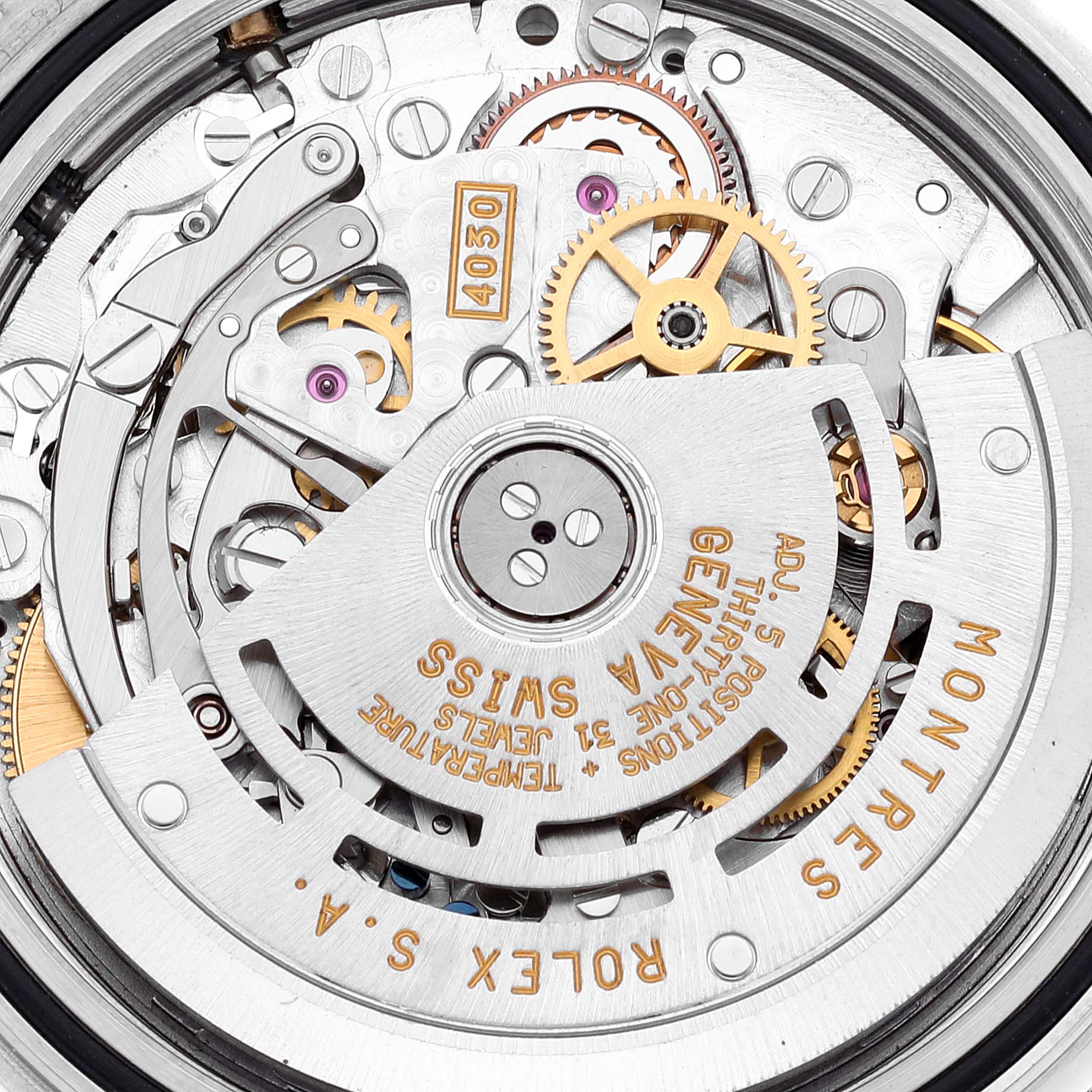 The image shows the intricate movement mechanism of a Rolex Daytona 16523 Men
s Steel and Gold (two tone) White Dial 16523 Men
s Steel and Gold (two tone) White Dial watch, featuring gears and the automatic rotor.