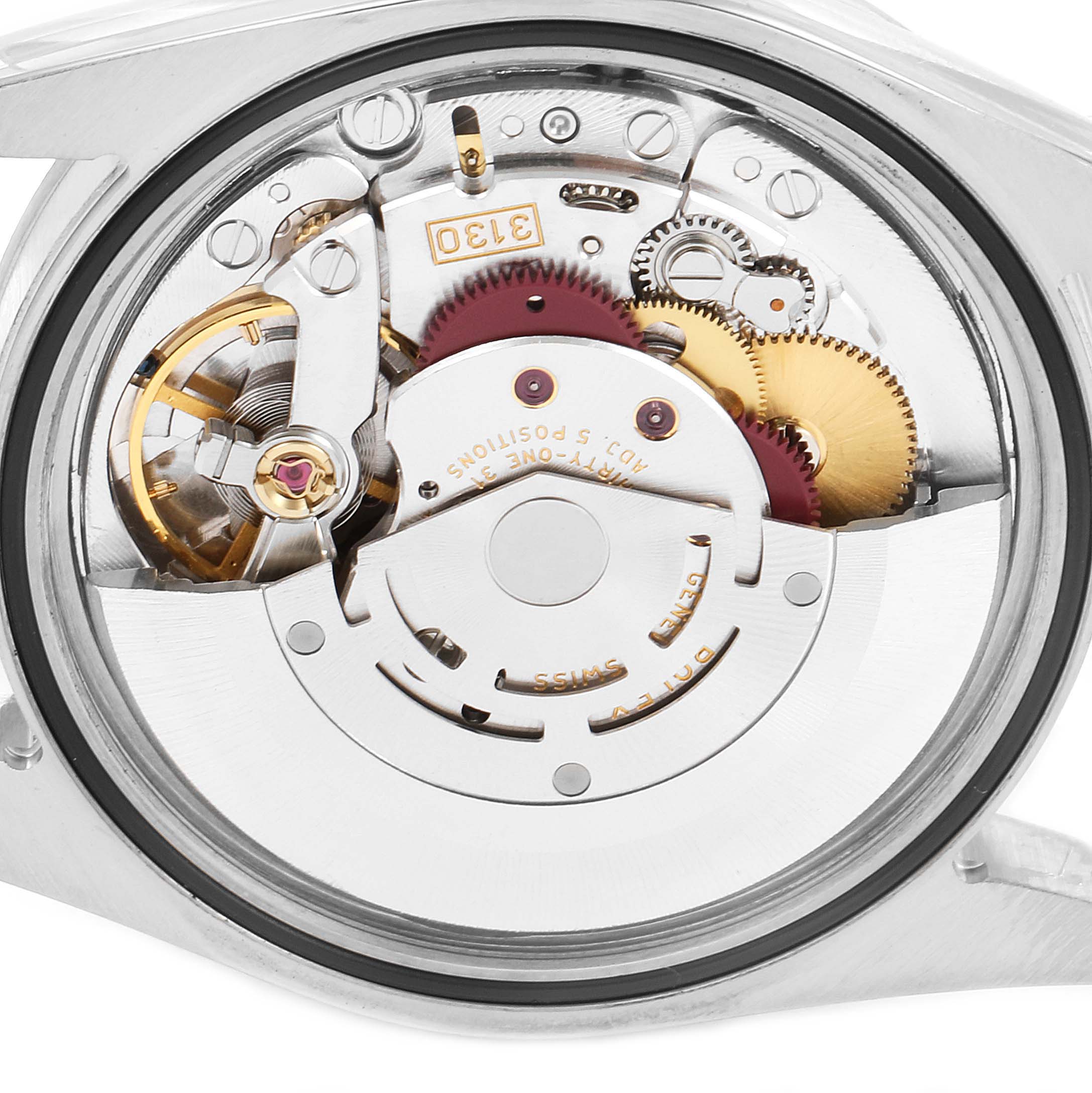 The image shows a close-up of the internal mechanism of a Rolex Explorer 114270 Men's Stainless Steel Black Dial 114270 Men's Stainless Steel Black Dial watch, including gears and moving parts.