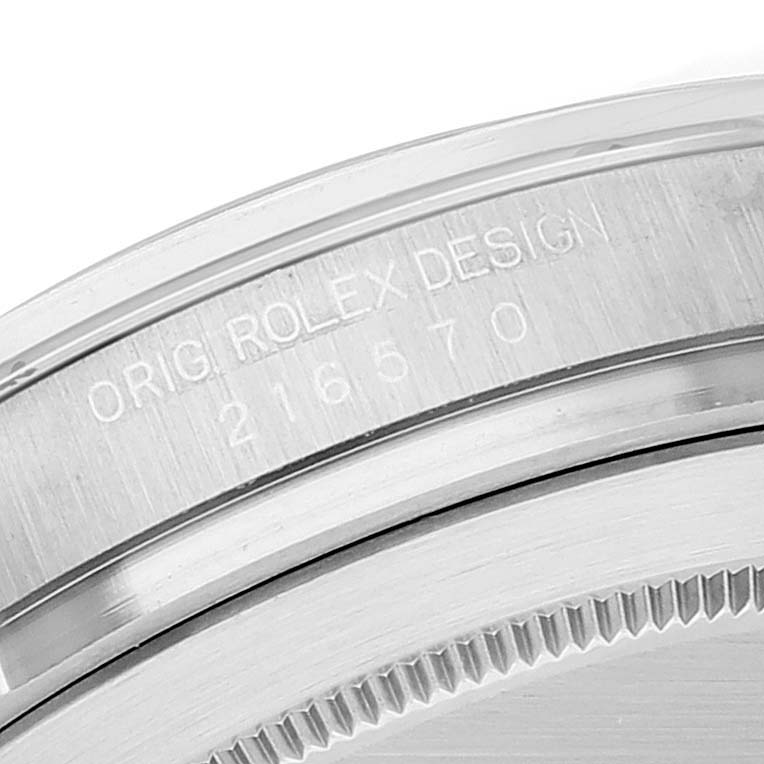 The image shows a close-up of the case back and edge engraving of the Rolex Explorer 216570 Men's Stainless Steel White Dial 216570 Men's Stainless Steel White Dial watch.