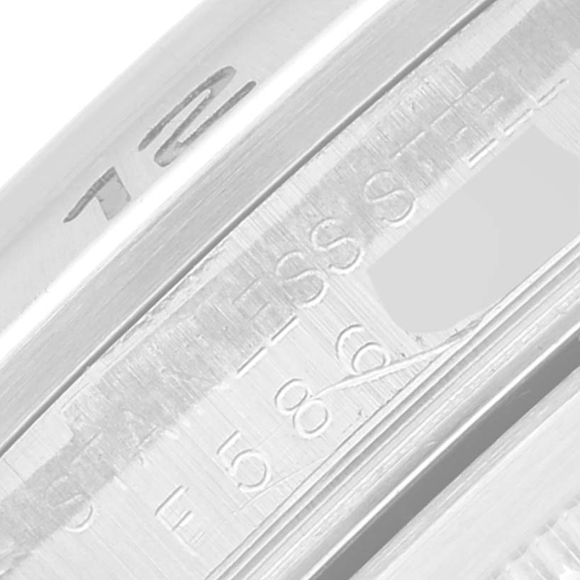 This image shows a close-up of the inner bezel and serial engraving of a Rolex Explorer 16570 Men
s Stainless Steel Black Dial 16570 Men
s Stainless Steel Black Dial watch.