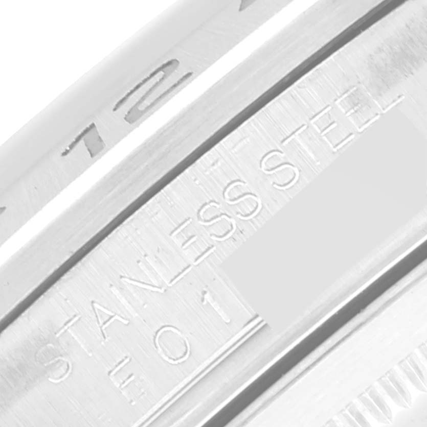 This close-up image shows the stainless steel engraving on the case of a Rolex Explorer 16570 Men's Stainless Steel Black Dial 16570 Men's Stainless Steel Black Dial watch.