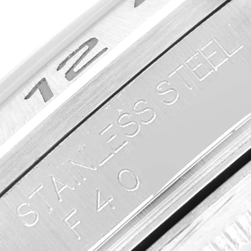 This close-up image shows the inner bezel and markings of a Rolex Explorer 16570 Men's Stainless Steel Black Dial 16570 Men's Stainless Steel Black Dial watch, highlighting the stainless steel label.