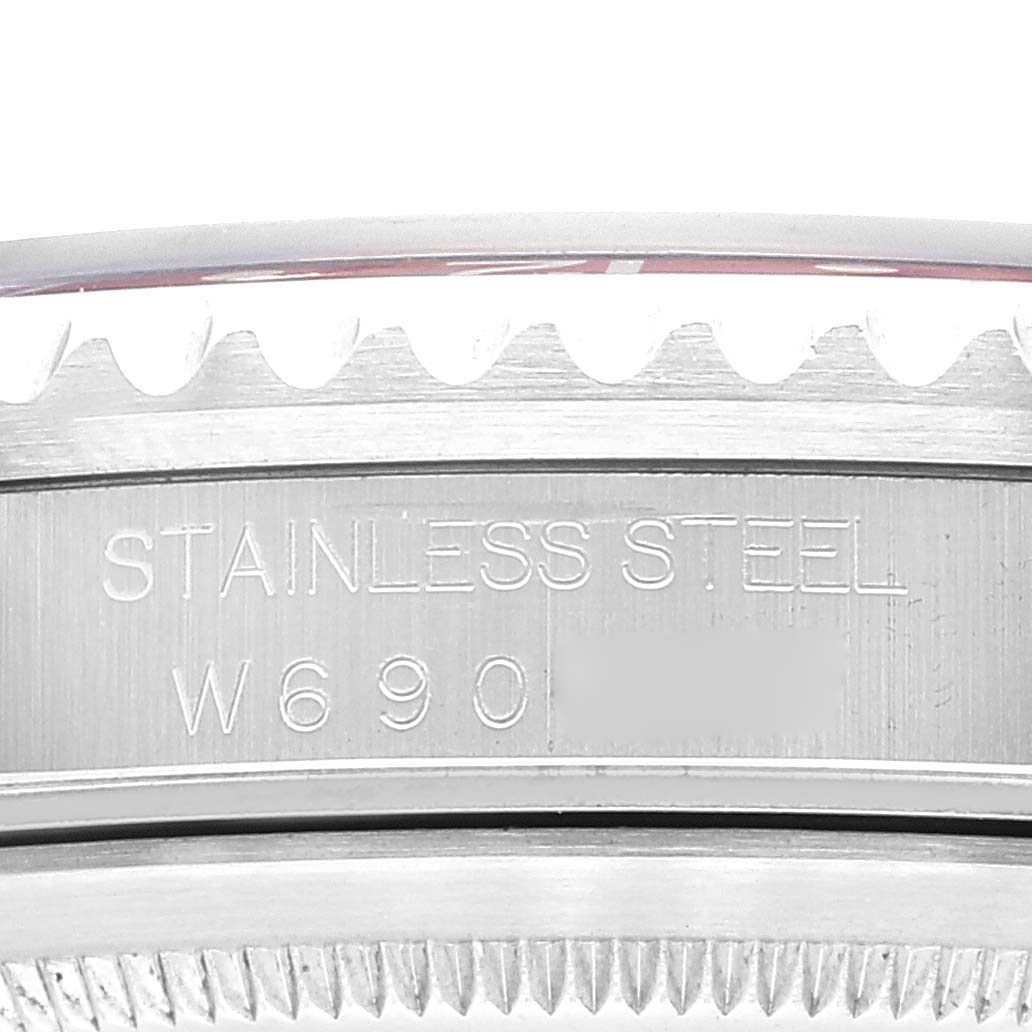 The image shows a close-up of the case side of a Rolex GMT-Master 16700 Men's Stainless Steel Black Dial 16700 Men's Stainless Steel Black Dial, highlighting its stainless steel material and model inscription.