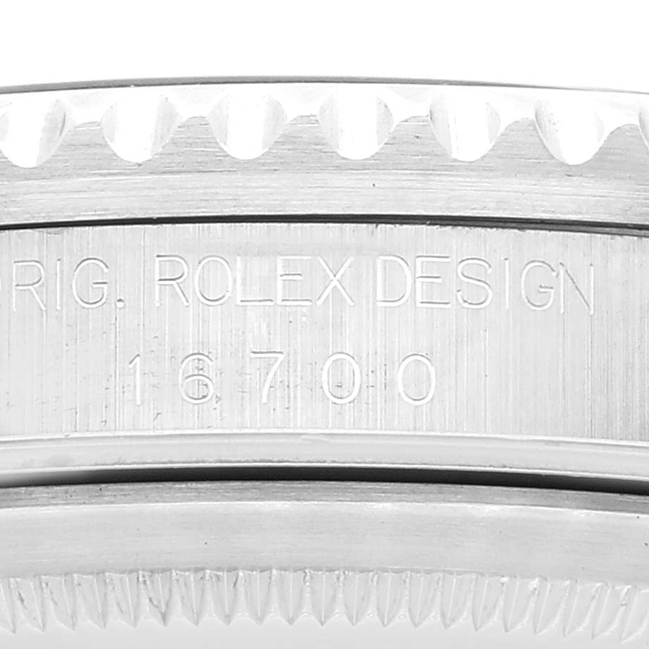 The image shows a close-up of the case side of a Rolex GMT-Master 16700 Men's Stainless Steel Black Dial 16700 Men's Stainless Steel Black Dial model, focusing on the model number "16700" engraving.