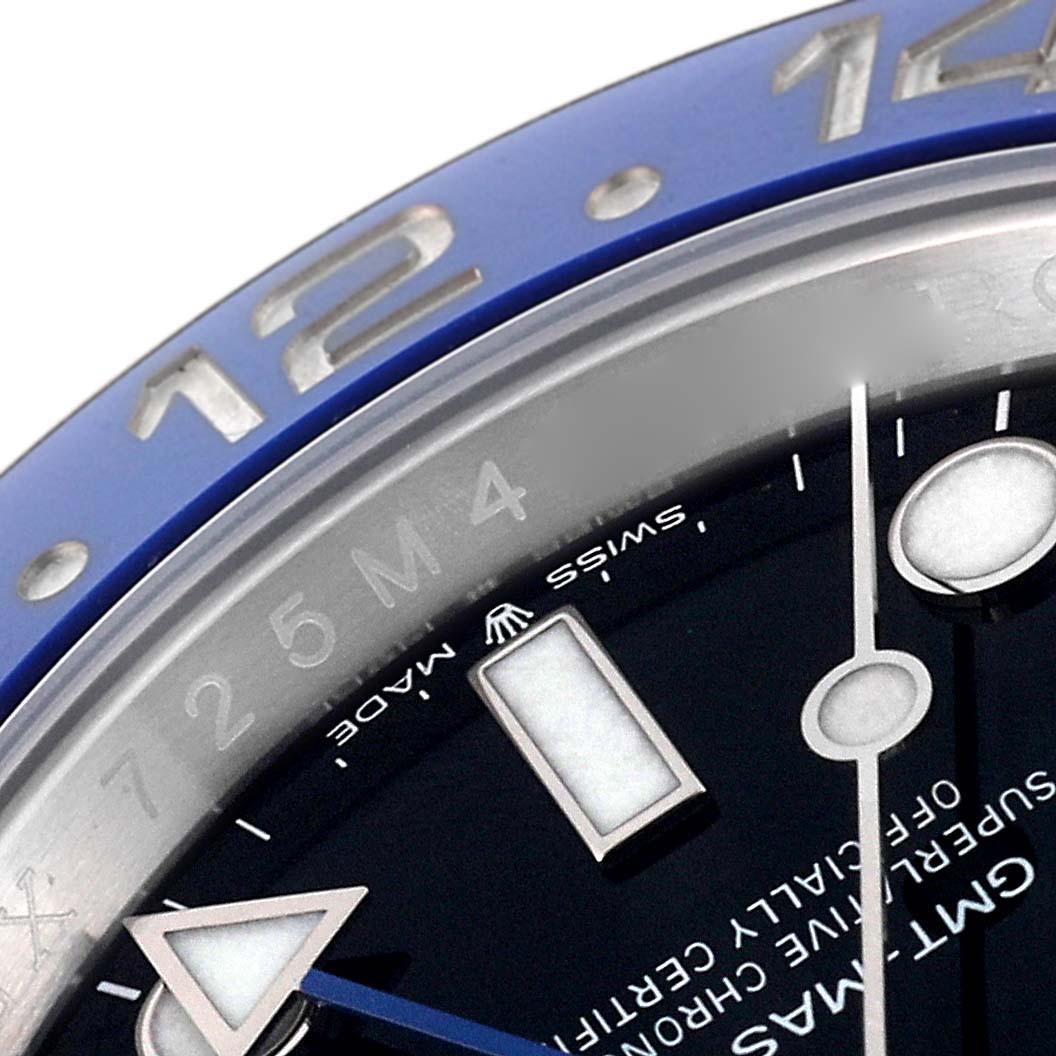 This close-up angle of the Rolex GMT-Master 126710 Men's Stainless Steel Black Dial 126710 Men's Stainless Steel Black Dial shows part of the bezel, dial, and watch hands.