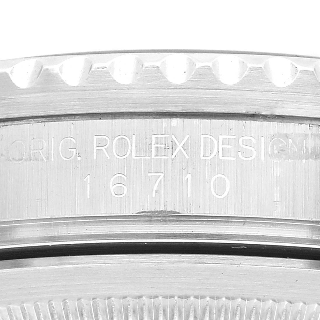 This image shows a close-up of the case side and bezel of a Rolex GMT-Master 16710 Men's Stainless Steel Black Dial 16710 Men's Stainless Steel Black Dial, featuring the design engraving.