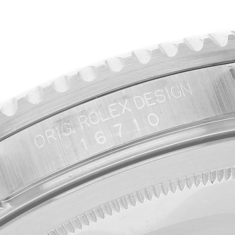 This close-up image shows the bezel and case side engraving of a Rolex GMT-Master 16710 Men
s Stainless Steel Black Dial 16710 Men
s Stainless Steel Black Dial watch, displaying "ORIG. ROLEX DESIGN" and the model number "16710."