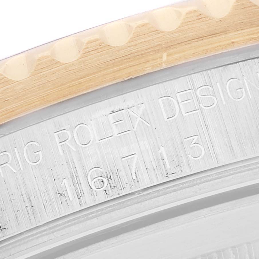 This close-up image shows the engraved details and edge of the bezel on a Rolex GMT-Master 16713 Men's Stainless Steel Brown Dial 16713 Men's Stainless Steel Brown Dial watch.