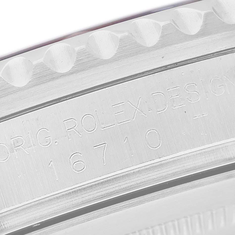 The image shows a close-up of the case side of a Rolex GMT-Master 16710 T Men's Stainless Steel Black Dial, displaying the model number engraving.