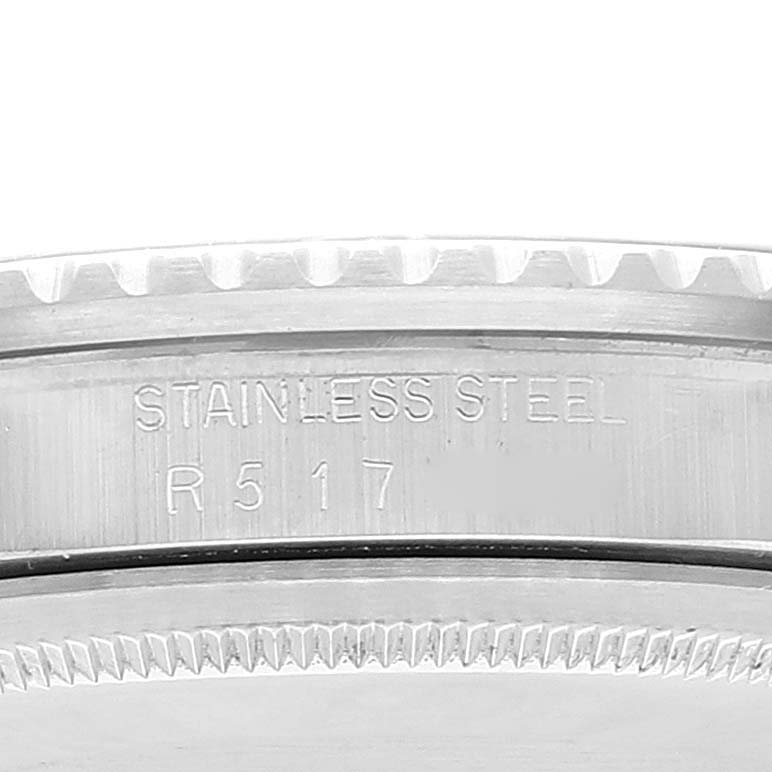 Close-up of the engraved side and bezel teeth of a stainless steel Rolex Vintage Collection 16750 Men's Stainless Steel Black Dial 16750 Men's Stainless Steel Black Dial watch, showing the model number R5117.