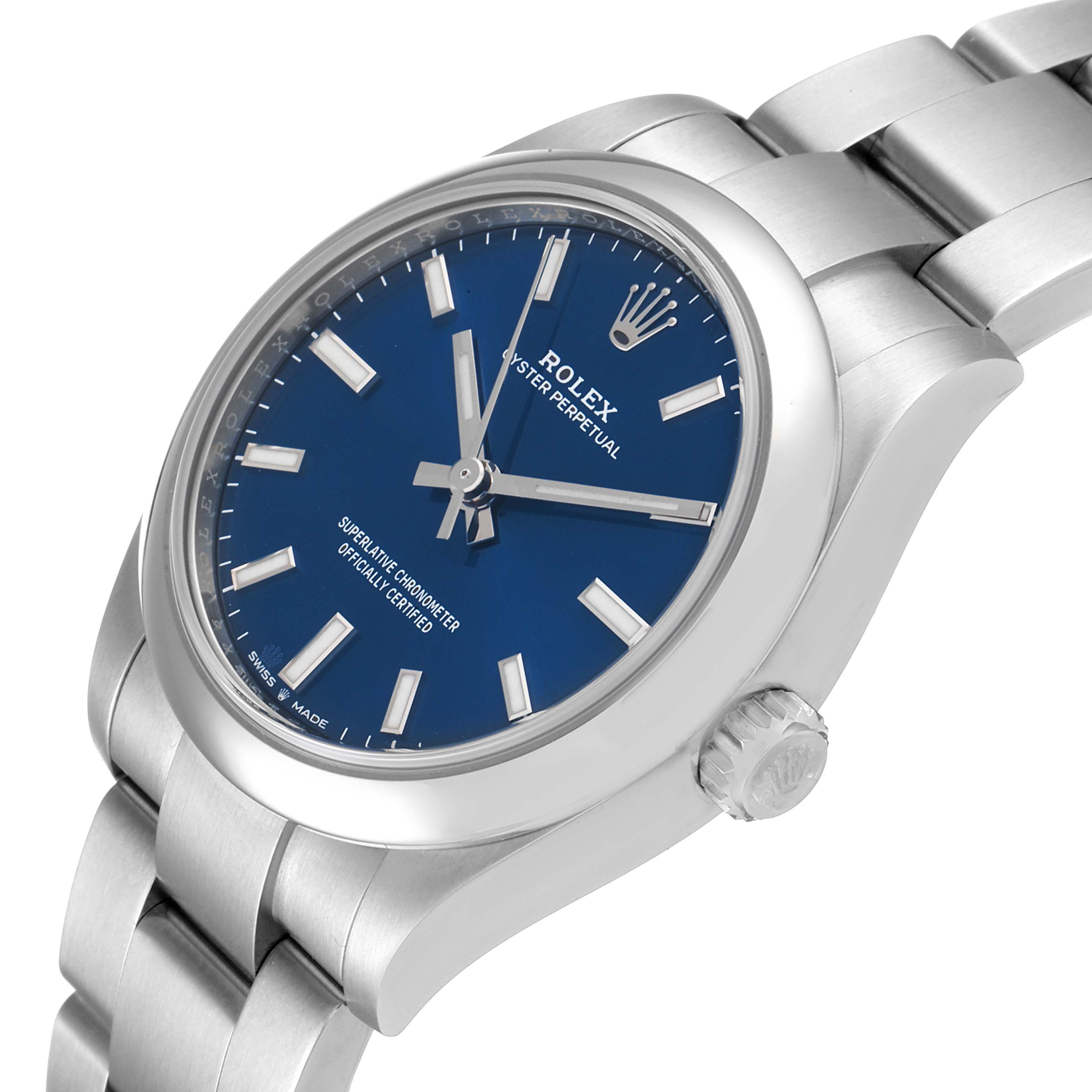 This image shows a Rolex Mid-Size 277200 Women's Stainless Steel Blue Dial 277200 Women's Stainless Steel Blue Dial Oyster Perpetual watch from an angled view, highlighting the dial, case, crown, and part of the bracelet.