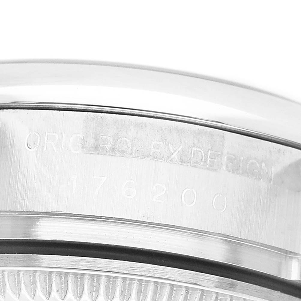 The image shows a close-up of the case side of a Rolex Oyster Perpetual 176200 Women's Stainless Steel Silver Dial watch with engraving details.