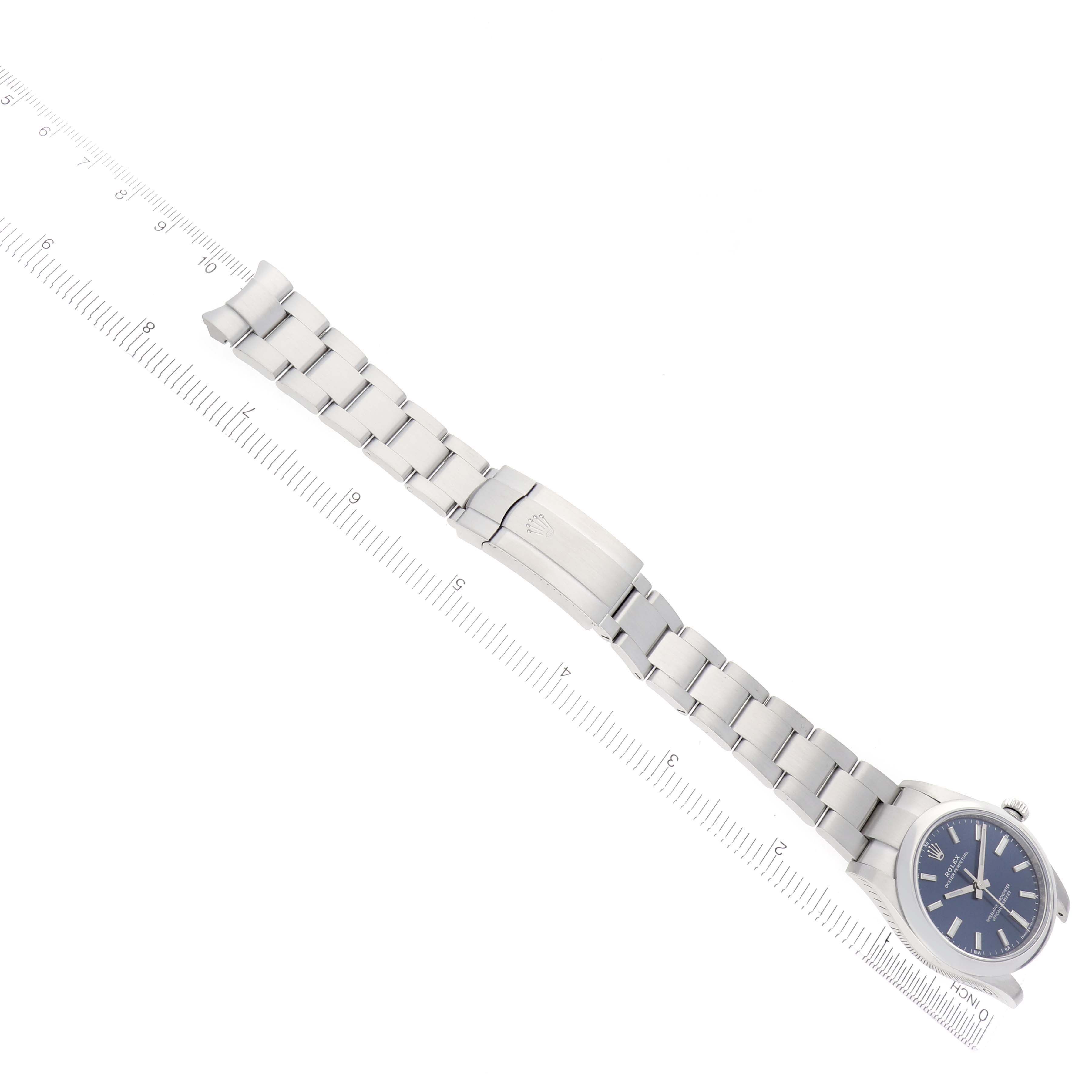 The image shows a Rolex Oyster Perpetual 124200 Men
s Stainless Steel Blue Dial 124200 Men
s Stainless Steel Blue Dial watch with a side view, highlighting the bracelet, clasp, and case.