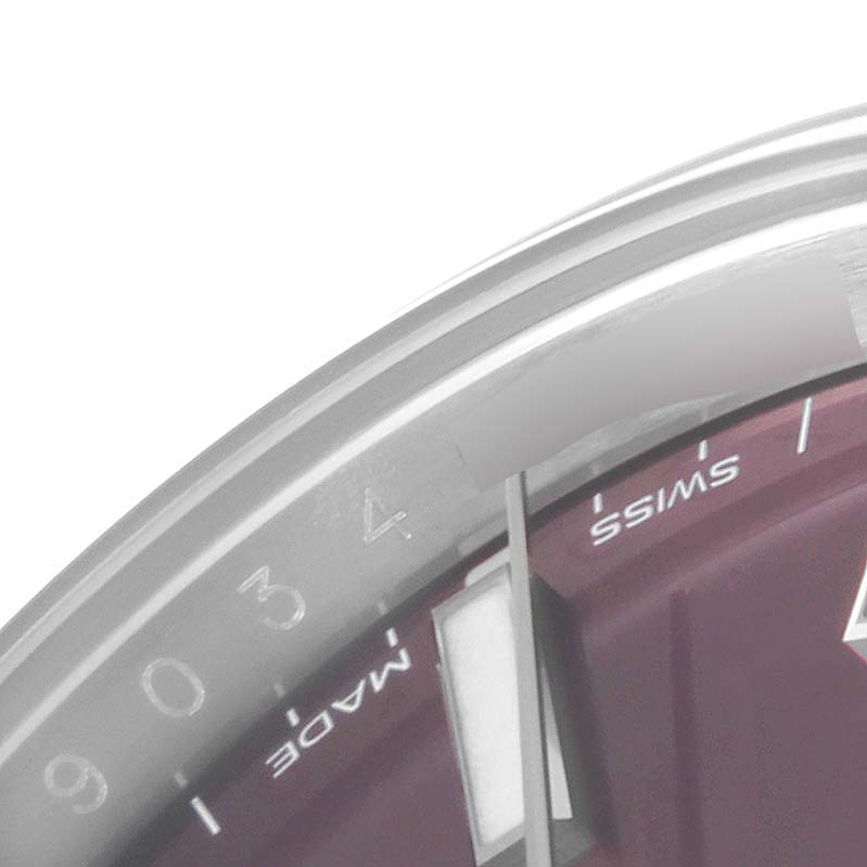 This image shows a close-up of the Rolex Oyster Perpetual 114200 Men's Stainless Steel Burgundy Dial 114200 Men's Stainless Steel Burgundy Dial watch, focusing on the watch face and bezel from an angled top view.