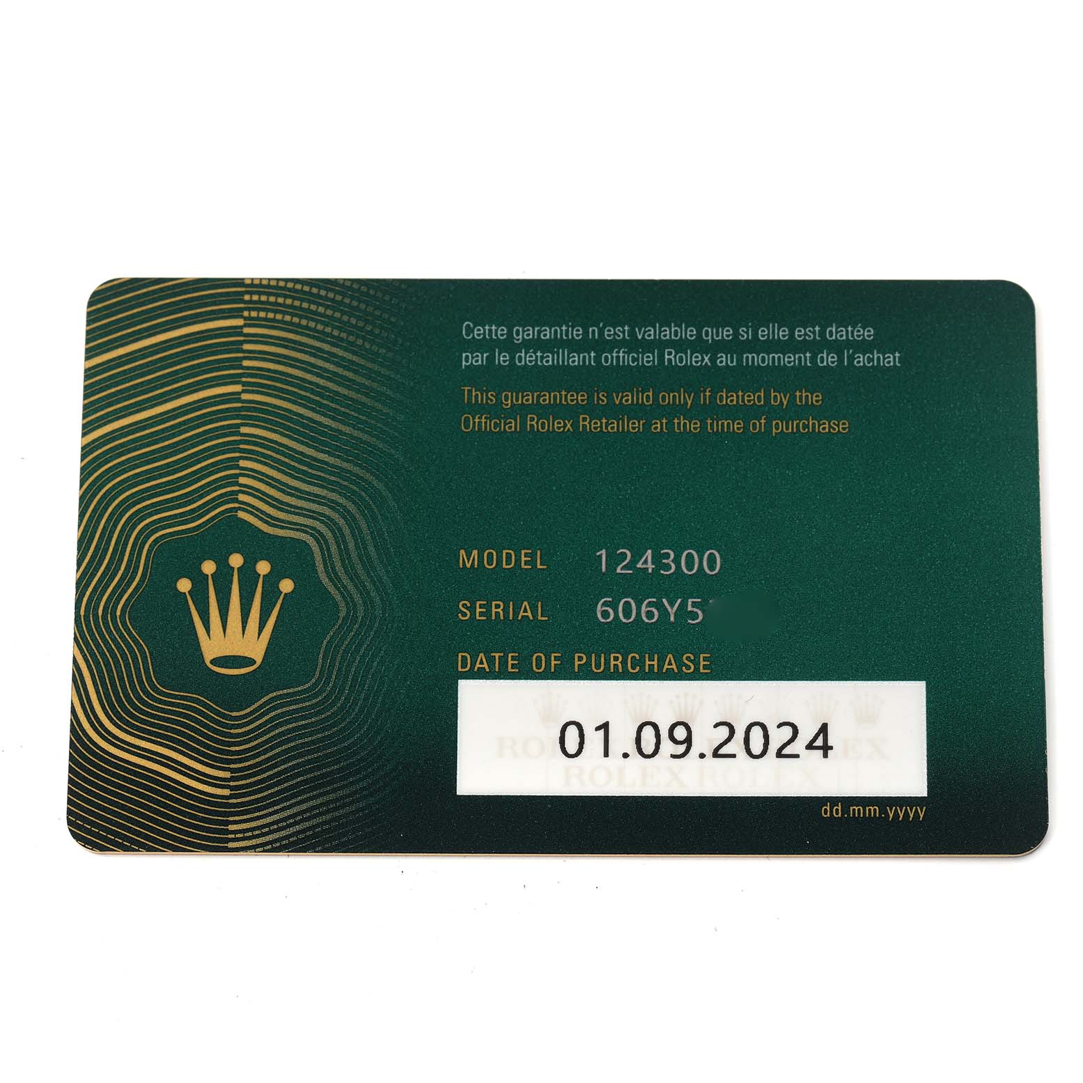 The image shows a warranty card for the Rolex Oyster Perpetual 124300 Men
s Stainless Steel Green Dial 124300 Men
s Stainless Steel Green Dial model, displaying model, serial numbers, and date of purchase.