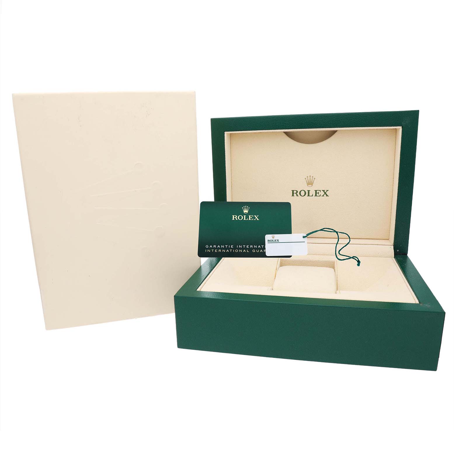 This image shows the open packaging for a Rolex Oyster Perpetual M124300-0002 Men's Stainless Steel Black Dial, including the box, warranty card, and a tag with branding.