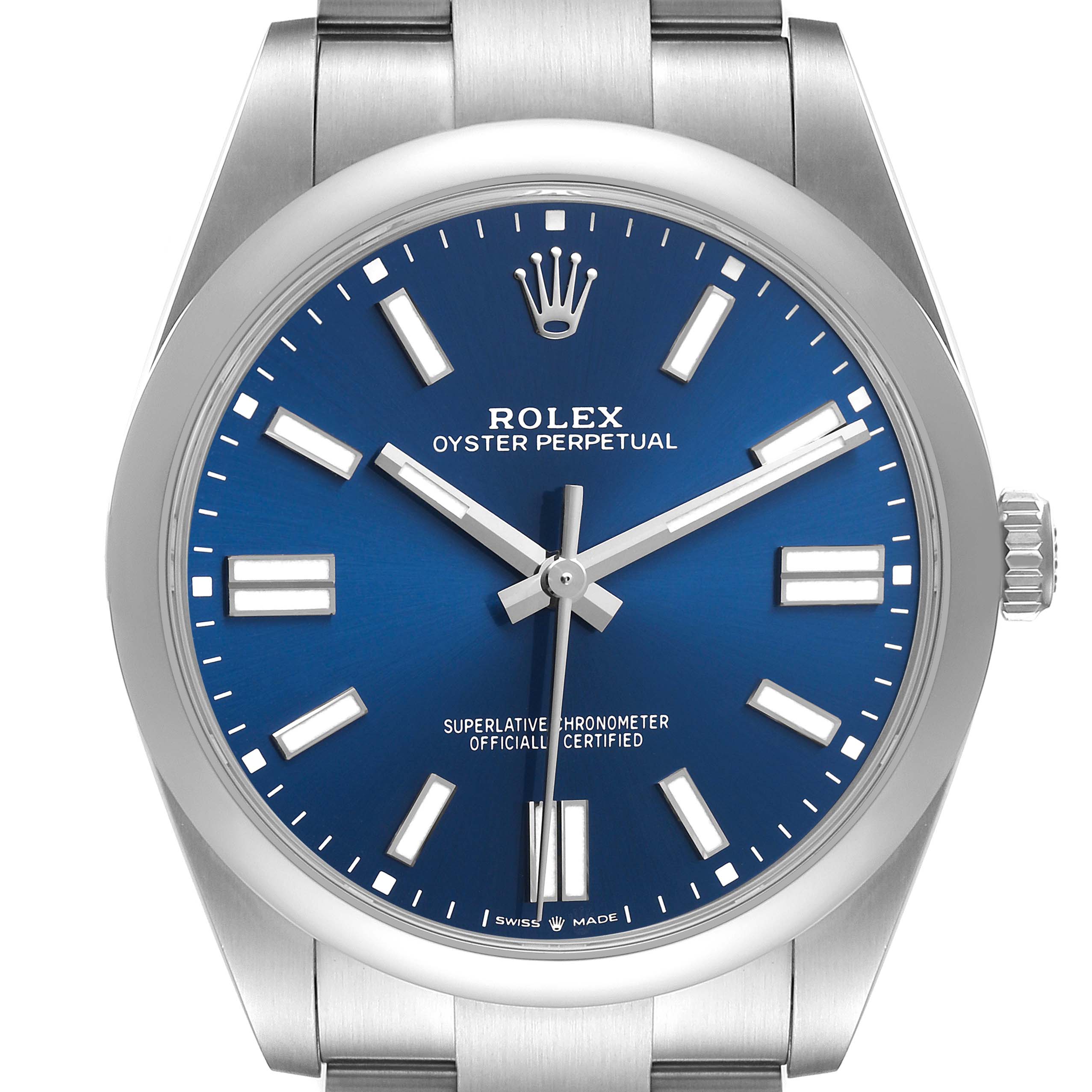 The Rolex Oyster Perpetual 124300 Men's Stainless Steel Blue Dial watch is shown from a frontal angle, displaying its blue dial, hour markers, and stainless steel bracelet.