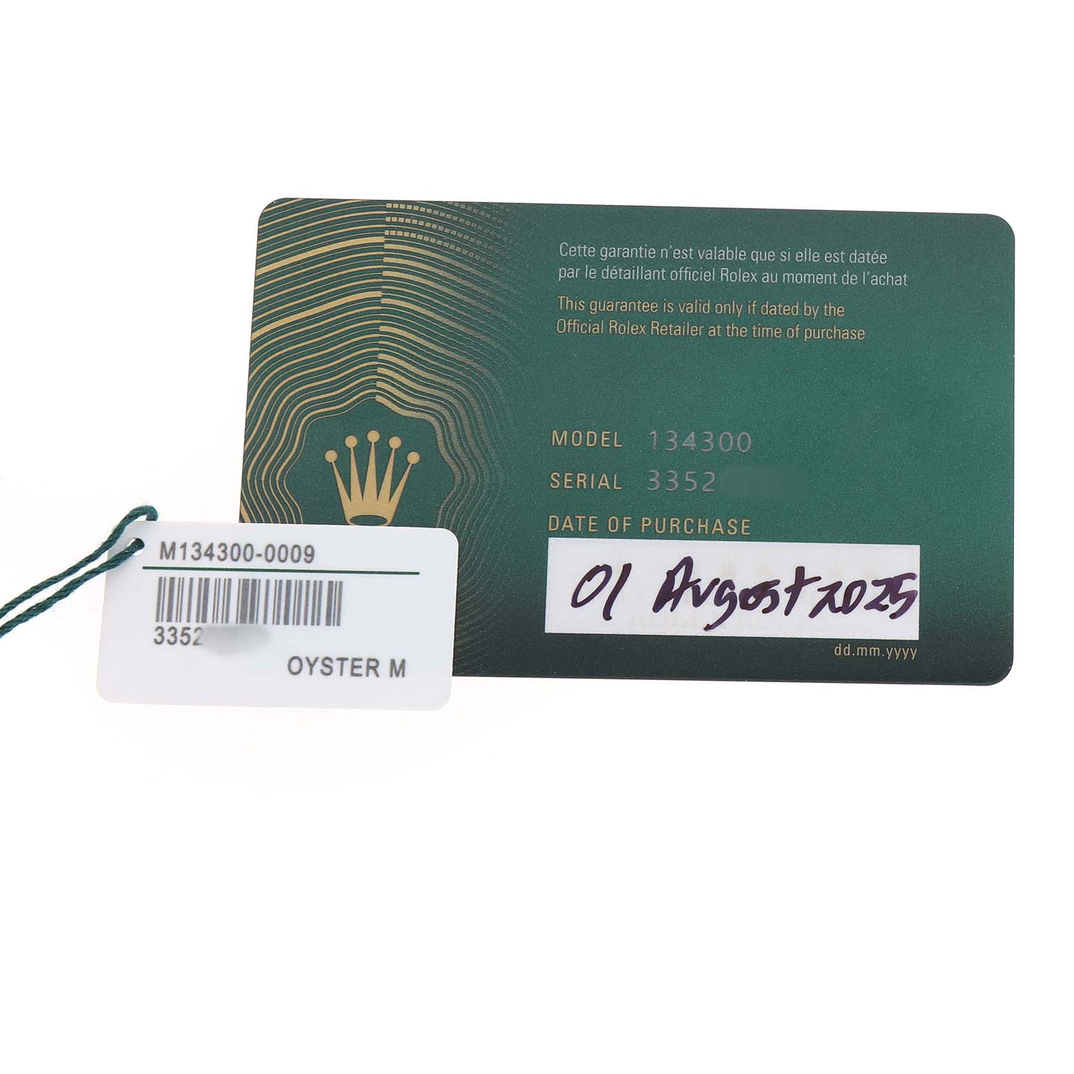 The image shows a Rolex Oyster Perpetual 134300 Men's Stainless Steel Blue Dial warranty card and a tag with model, serial numbers, and purchase date details.