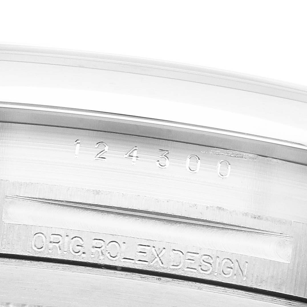 The image shows the engraved reference number on the side of the case of a Rolex Oyster Perpetual 124300 Men's Stainless Steel Silver Dial watch.