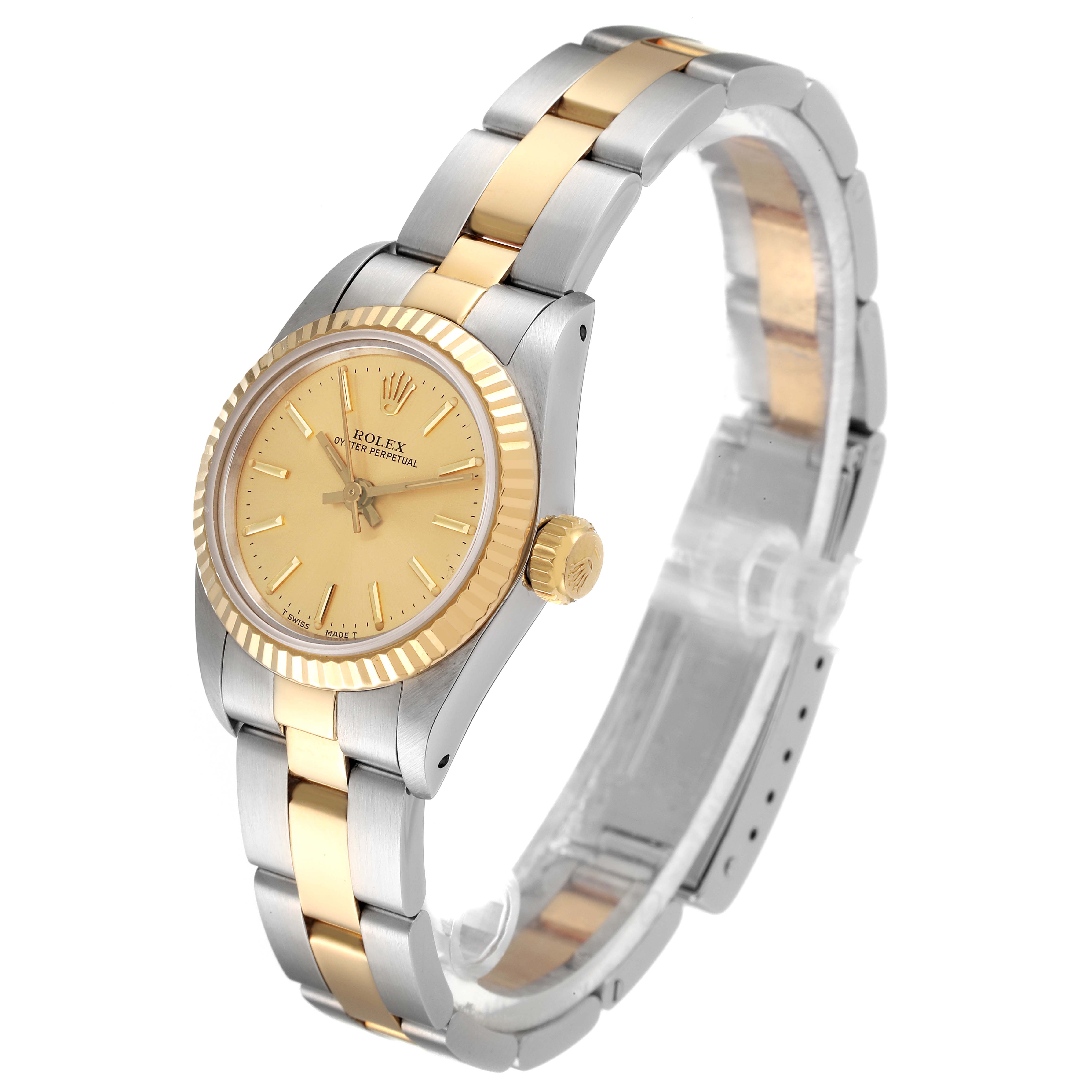 The Rolex Oyster Perpetual 67193 Women
s Steel and Gold (two tone) Champagne Dial 67193 Women
s Steel and Gold (two tone) Champagne Dial watch is shown from an angled side view, highlighting the gold and silver elements of its band and bezel.