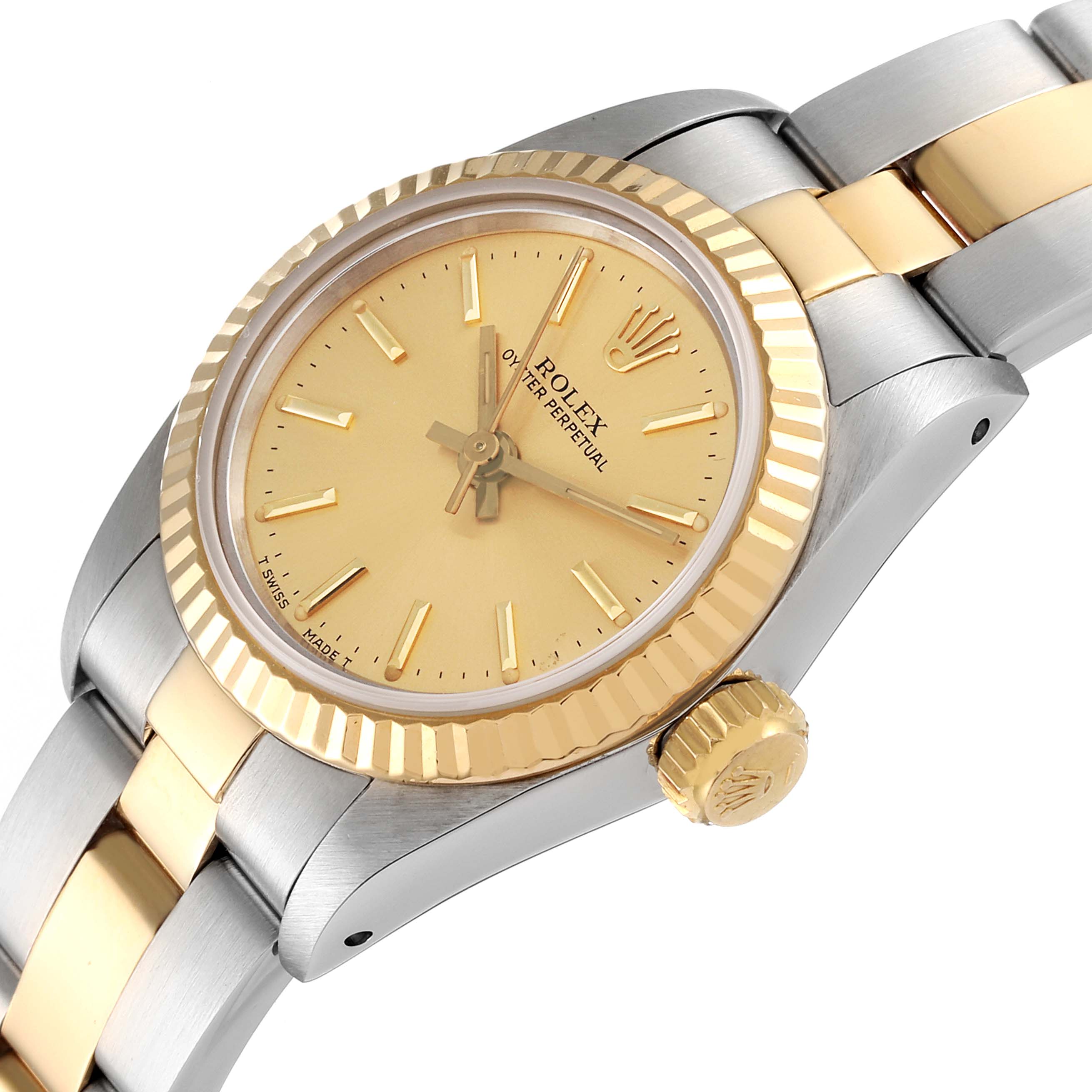 The image shows a close-up angle of a Rolex Oyster Perpetual 67193 Women
s Steel and Gold (two tone) Champagne Dial 67193 Women
s Steel and Gold (two tone) Champagne Dial watch, highlighting the dial, bezel, crown, and part of the bracelet.