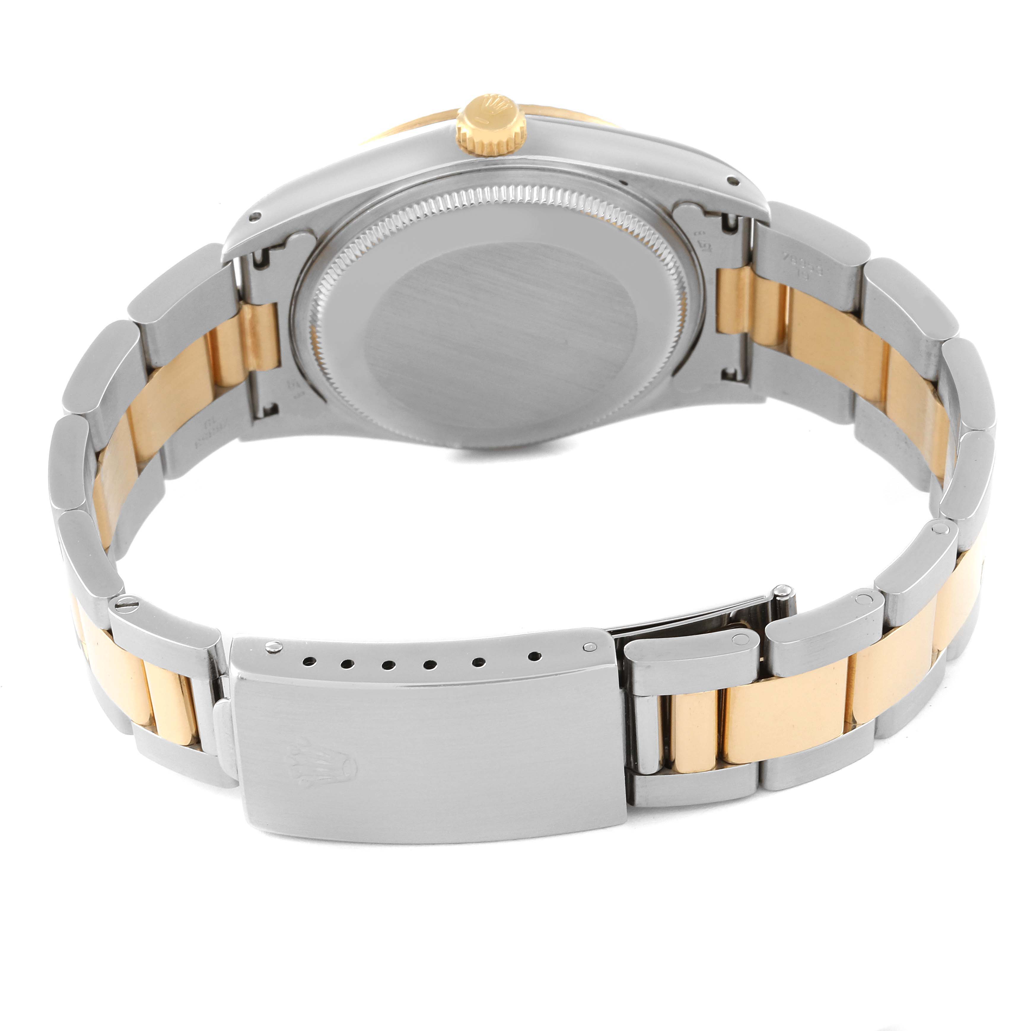 This image shows the back case and bracelet of a Rolex Oyster Perpetual 14233 Men's Steel and Gold (two tone) Champagne Dial 14233 Men's Steel and Gold (two tone) Champagne Dial watch.