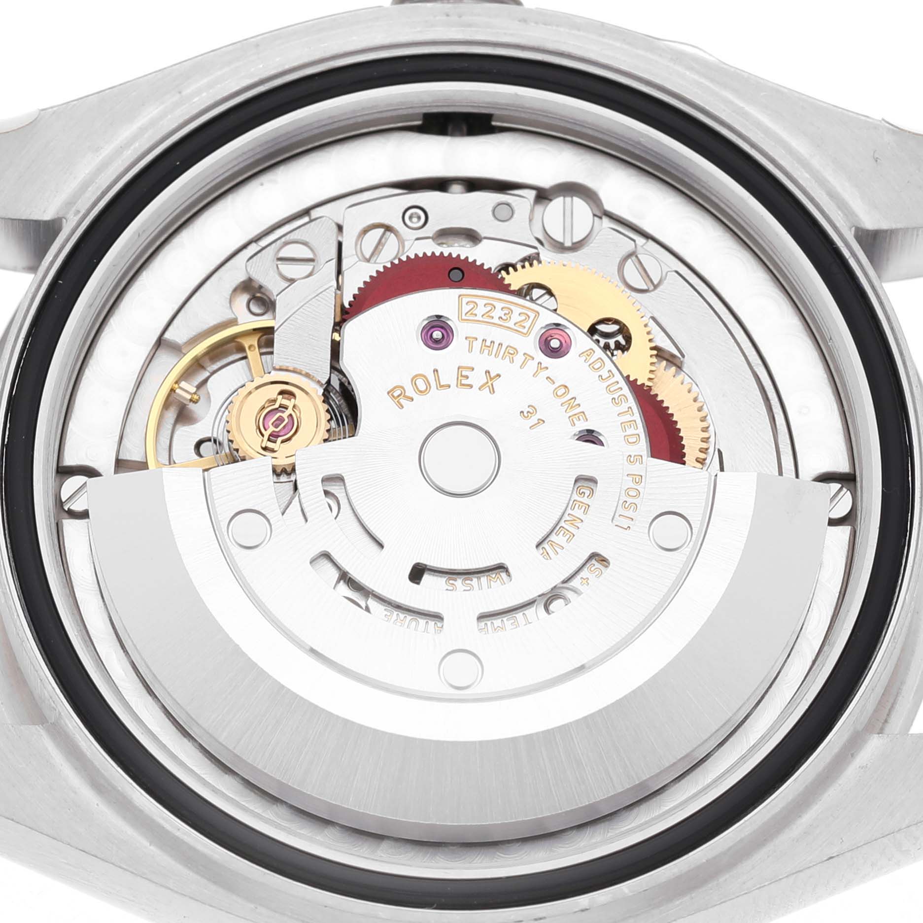 The image shows the back view of a Rolex Oyster Perpetual 277200 Women's Stainless Steel Green Dial, revealing its internal movement and mechanical parts.