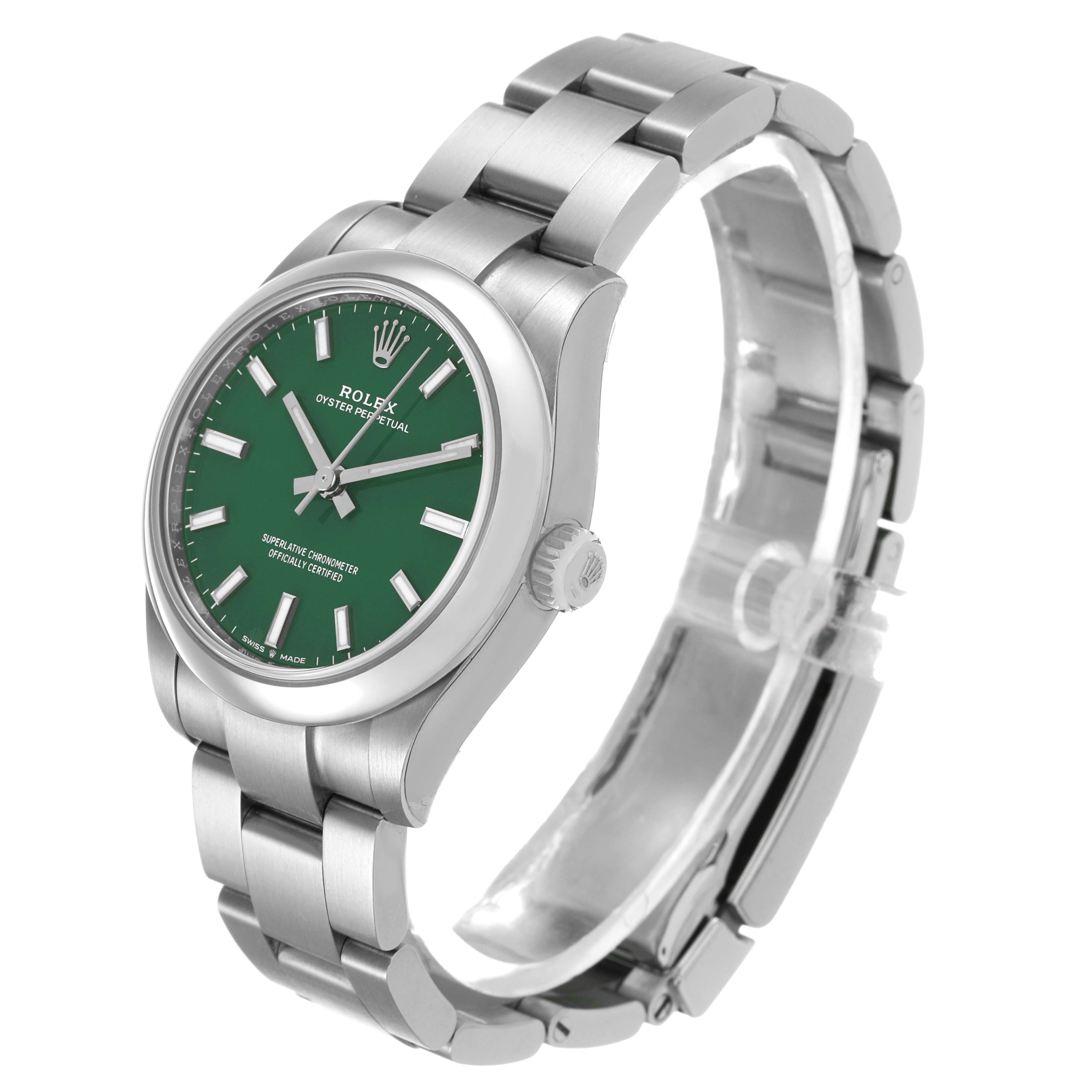 The Rolex Oyster Perpetual 277200 Women's Stainless Steel Green Dial watch is shown at a three-quarter angle, displaying the green dial, bracelet, and crown.