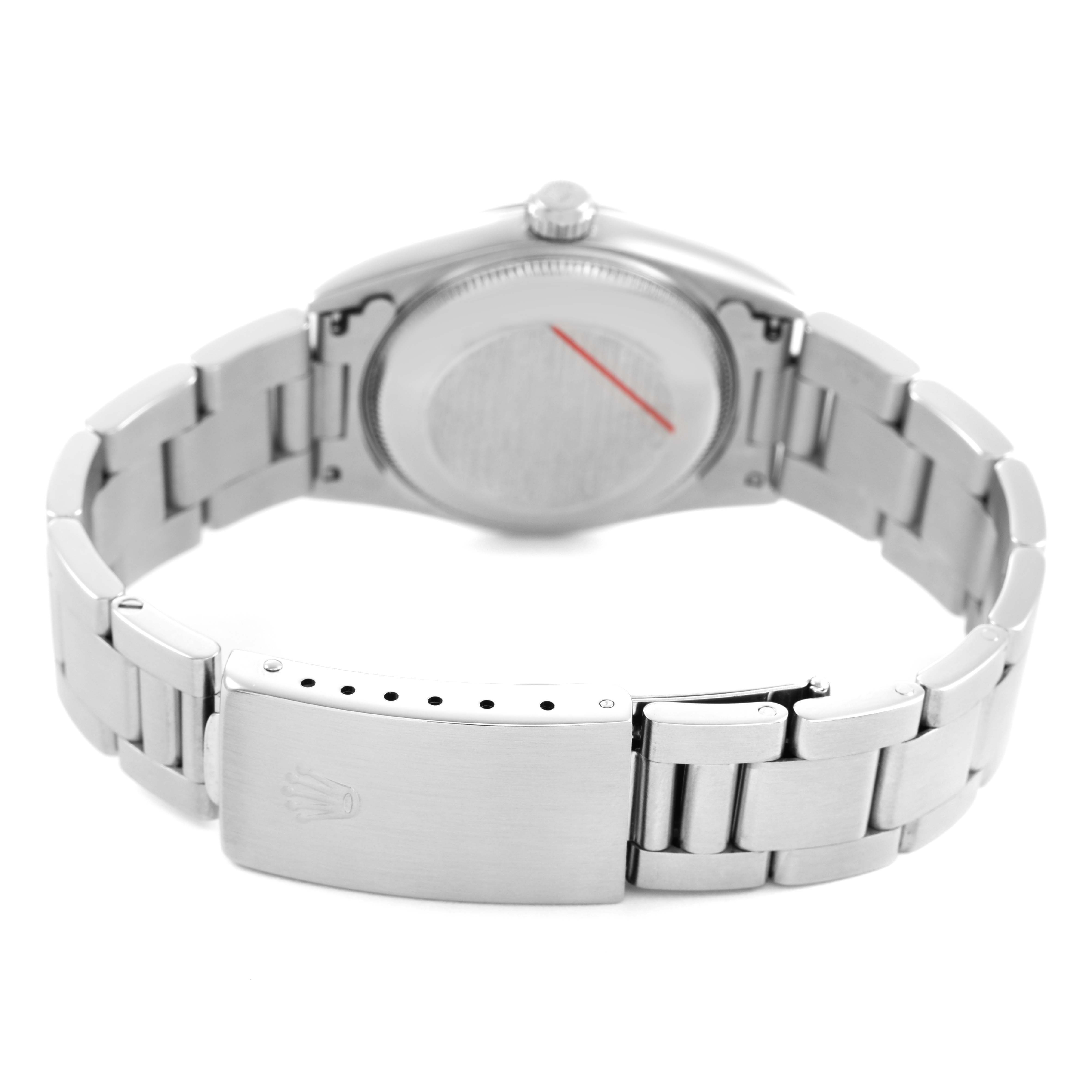 The image shows the back and bracelet of a Mid-Size Rolex watch, highlighting the clasp and case back from a rear angle.