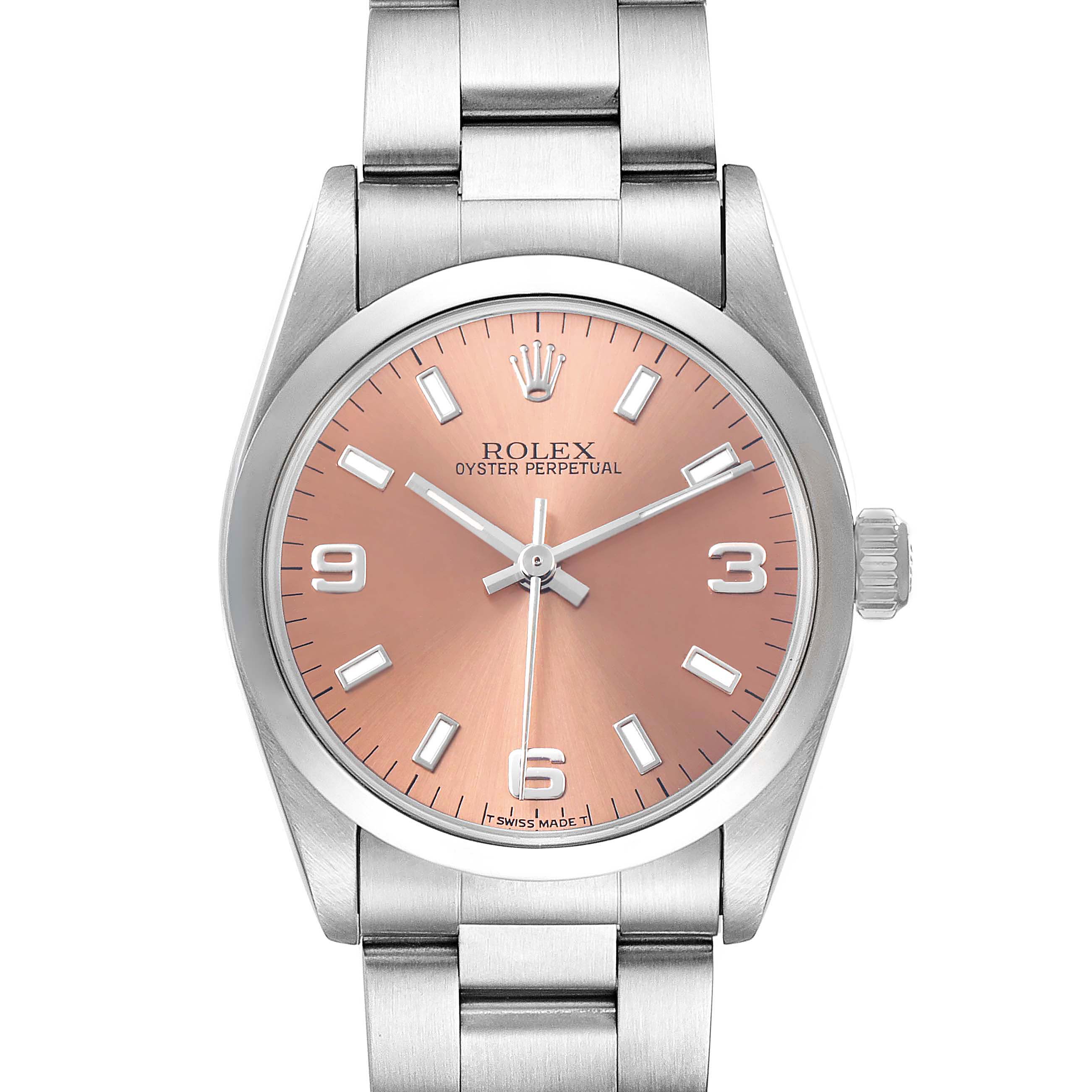 The Rolex Mid-Size 67480 Women's Stainless Steel Pink Dial watch is shown from a front angle, highlighting the pink dial, hands, markers, and stainless steel bracelet.