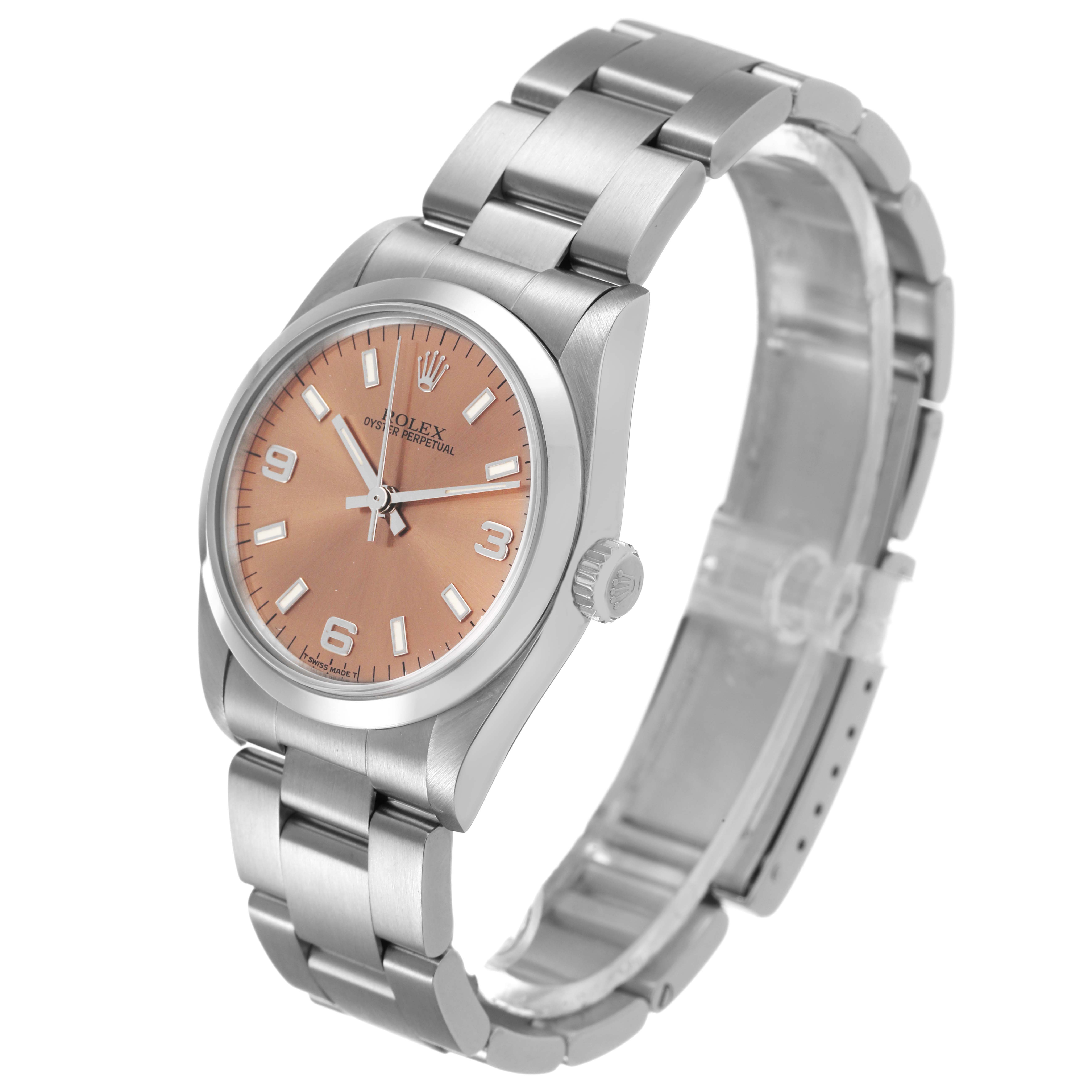 The Rolex Mid-Size 67480 Women's Stainless Steel Pink Dial watch is shown at an angled view, displaying the face, bezel, crown, and full bracelet.