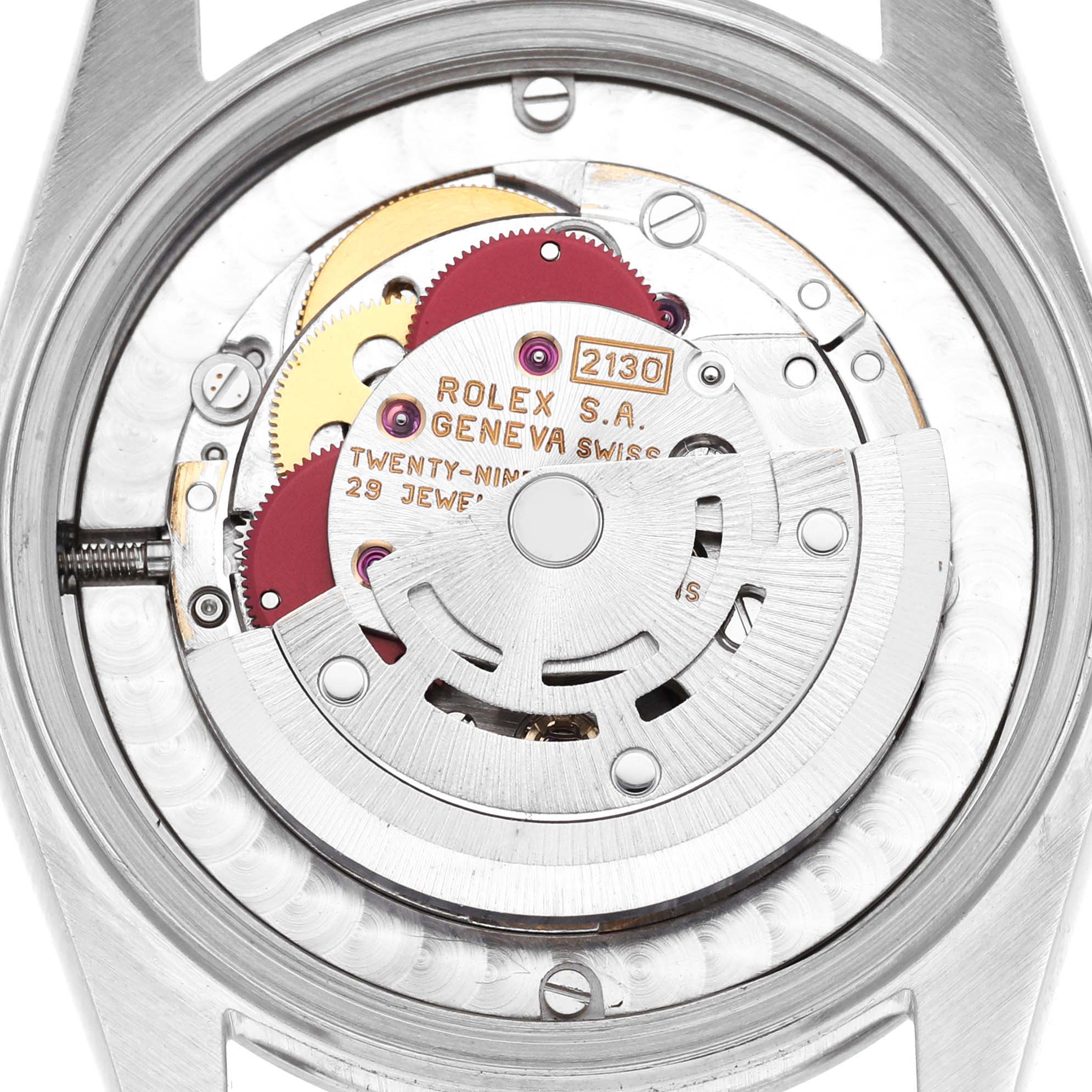 The image shows the internal movement of a Rolex Mid-Size 67480 Women's Stainless Steel Pink Dial model, focusing on the rotor and gear components.