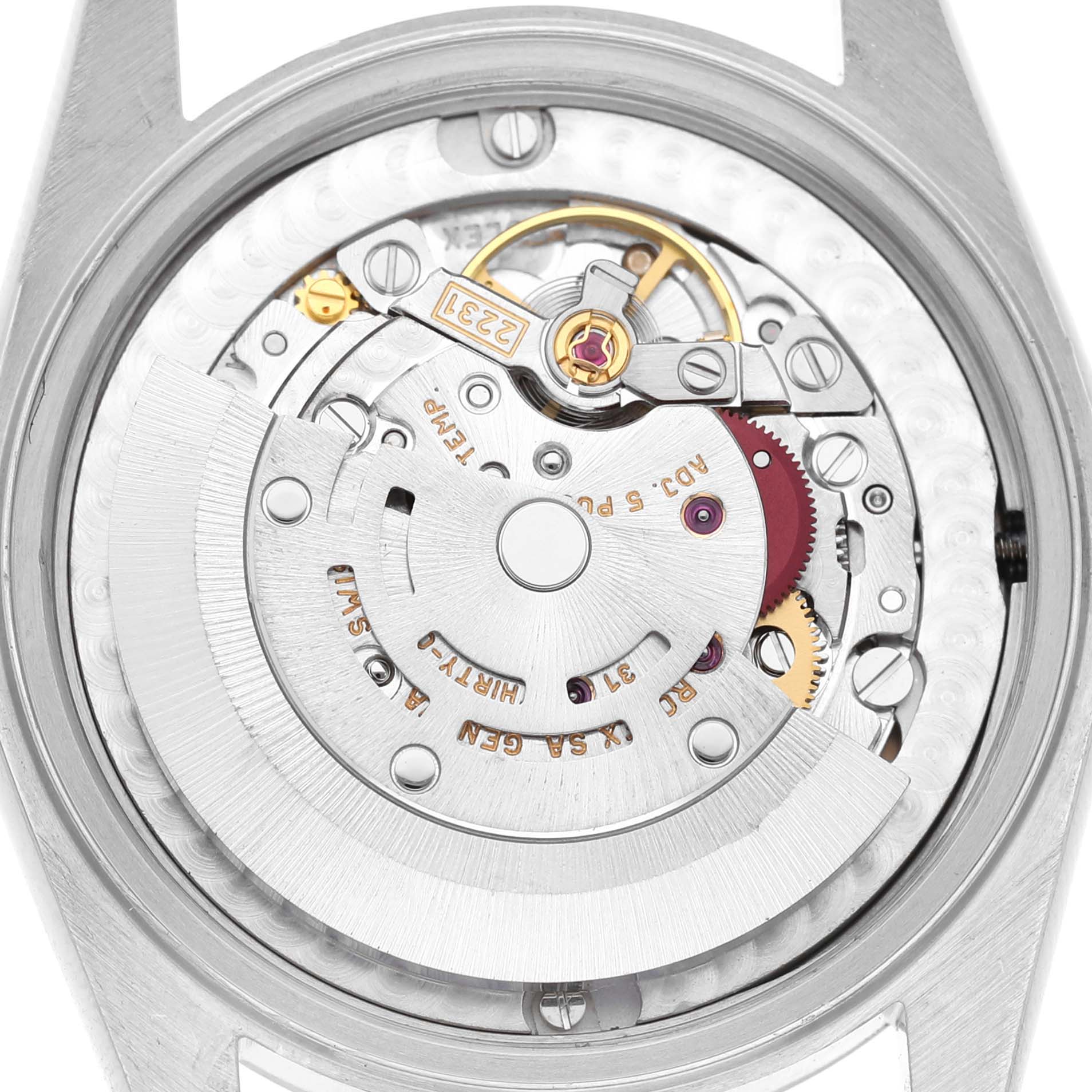 The image shows the intricate movement parts of a Rolex Oyster Perpetual 77080 Women's Stainless Steel Silver Dial watch from a rear angle, highlighting the rotor and gear mechanisms.