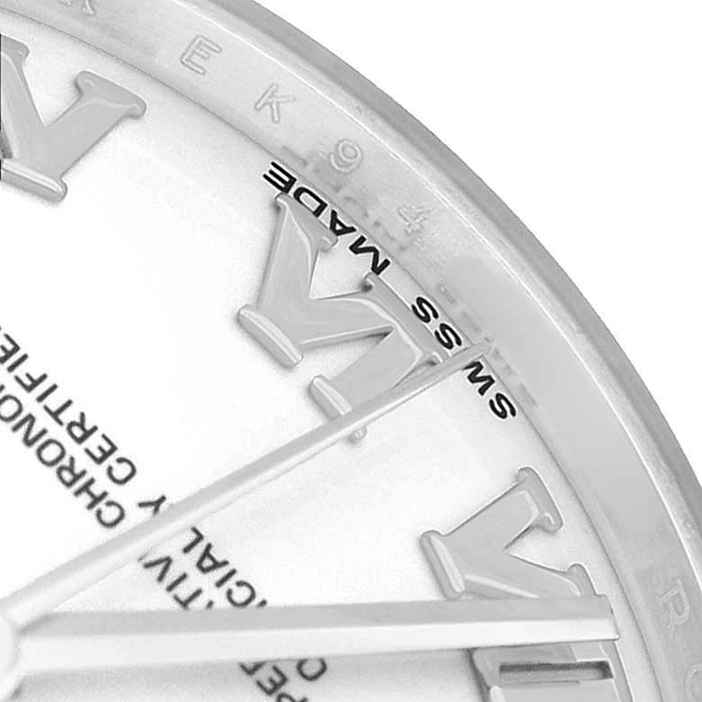 The image shows a close-up of the dial, markers, and hands of a Rolex Oyster Perpetual 77080 Women's Stainless Steel Silver Dial watch.