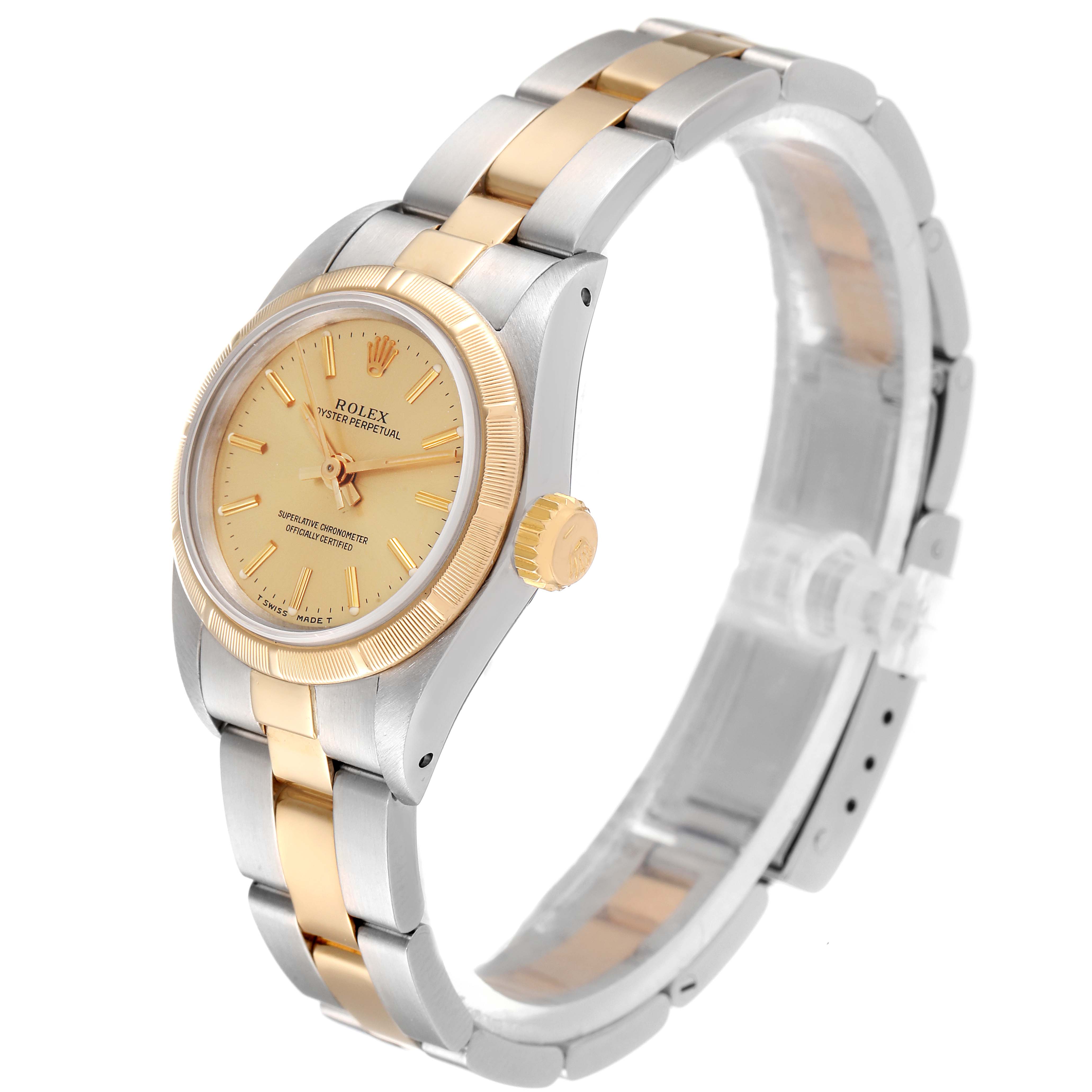 The Rolex Oyster Perpetual 67233 Women
s Steel and Gold (two tone) Champagne Dial 67233 Women
s Steel and Gold (two tone) Champagne Dial watch is shown at a slight angle, showcasing its dial, crown, and two-tone bracelet.