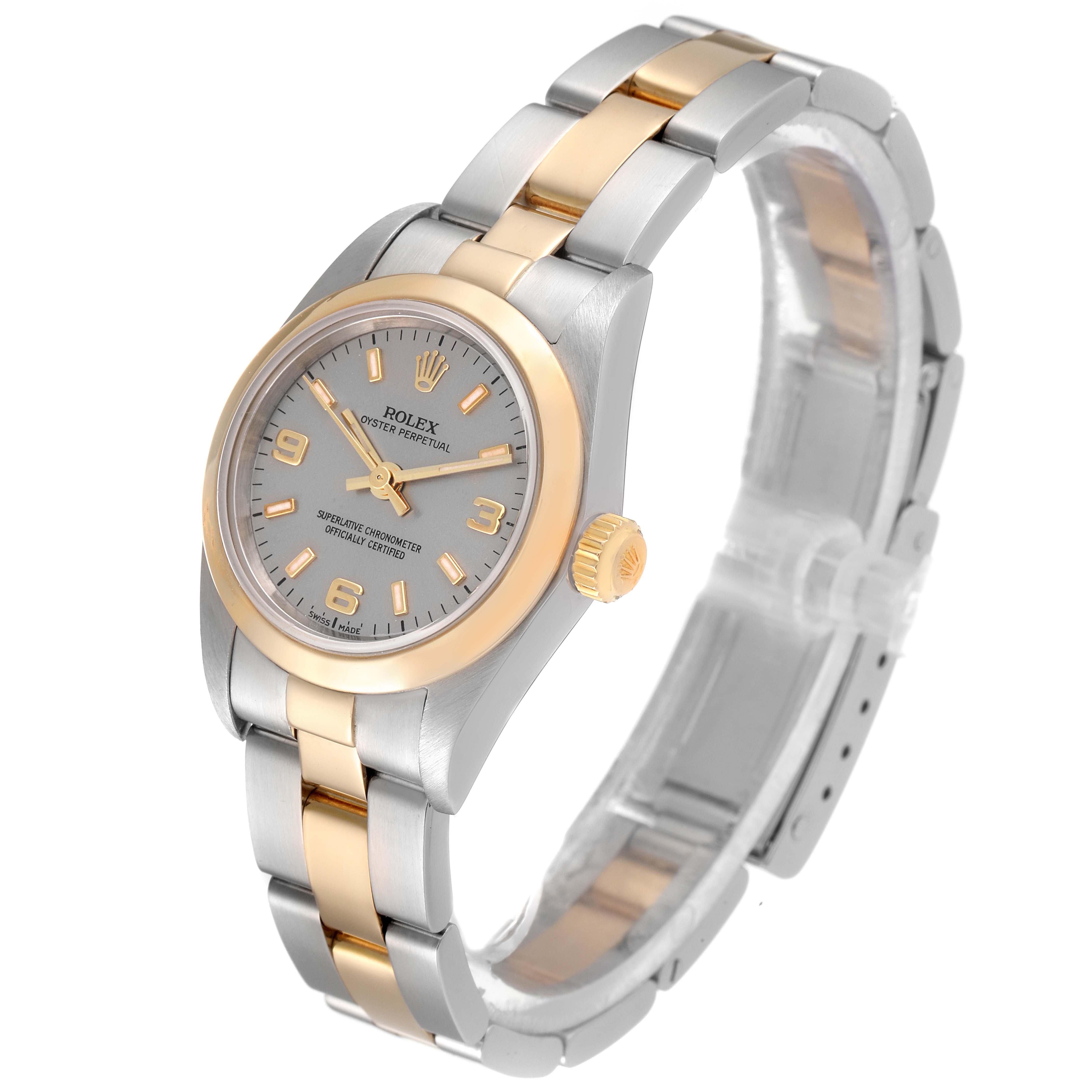 This image shows a Rolex Oyster Perpetual 76183 Women's Steel and Gold (two tone) Grey Dial 76183 Women's Steel and Gold (two tone) Grey Dial model watch at an angled view, highlighting the face, bezel, and bracelet.