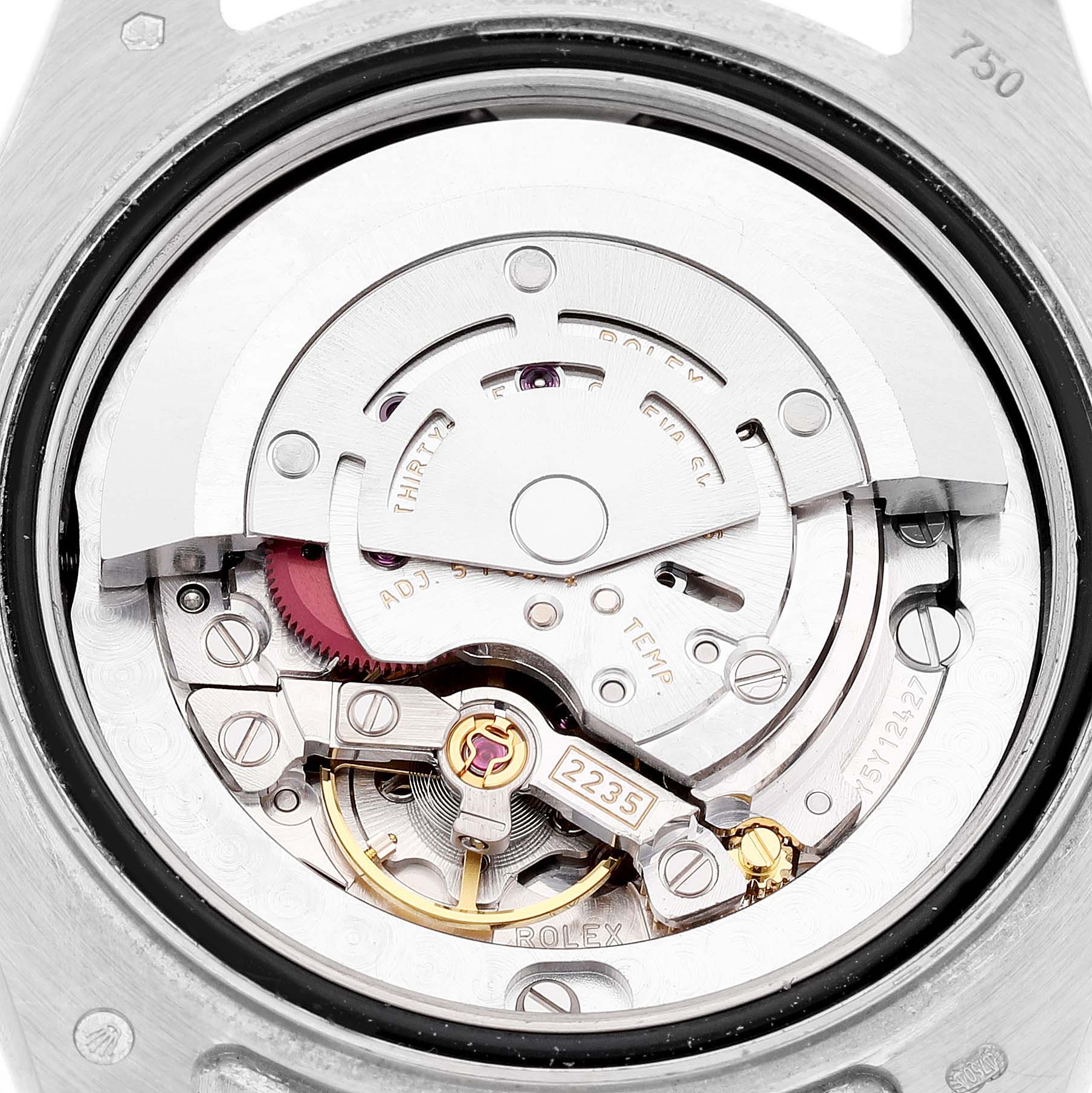 This image shows the movement from the back of a Rolex Pearlmaster 81299 Women's White Gold Black Dial, displaying its intricate mechanical components.