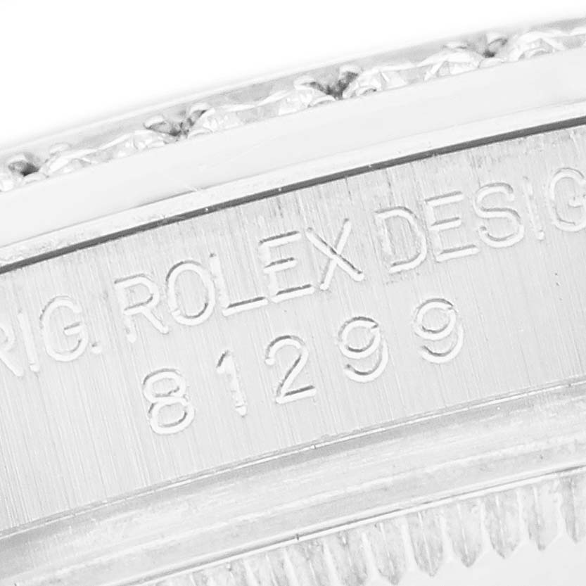 The image shows a close-up of the side and bezel engraving on a Rolex Pearlmaster 81299 Women's White Gold Black Dial watch.