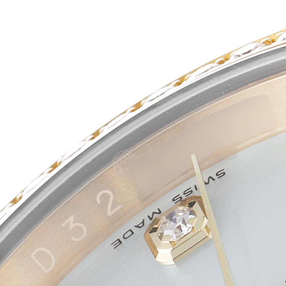 The image shows a close-up of the Rolex President 116188 Men's Yellow Gold Mother of Pearl Dial 116188 Men's Yellow Gold Mother of Pearl Dial model watch dial, showcasing the edge, diamond, and part of the minute hand.