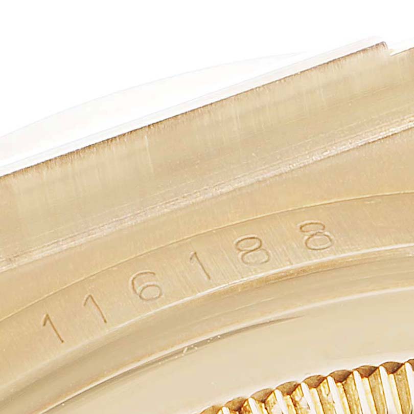 This image shows a close-up of the engraved bezel and case of the Rolex President 116188 Men's Yellow Gold Mother of Pearl Dial 116188 Men's Yellow Gold Mother of Pearl Dial model watch.