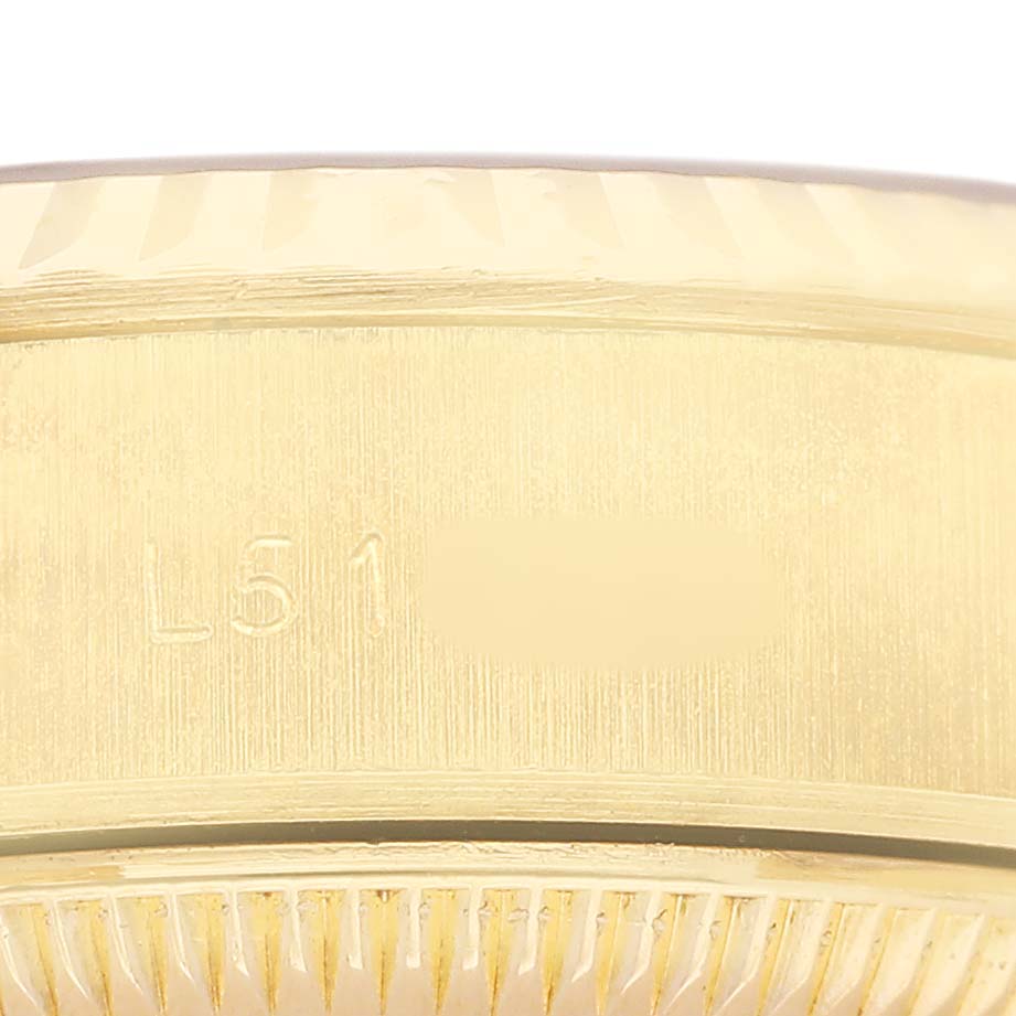 The image shows a close-up of the Rolex Datejust 69178 Women's Yellow Gold Champagne Dial model's engraved watch case side.