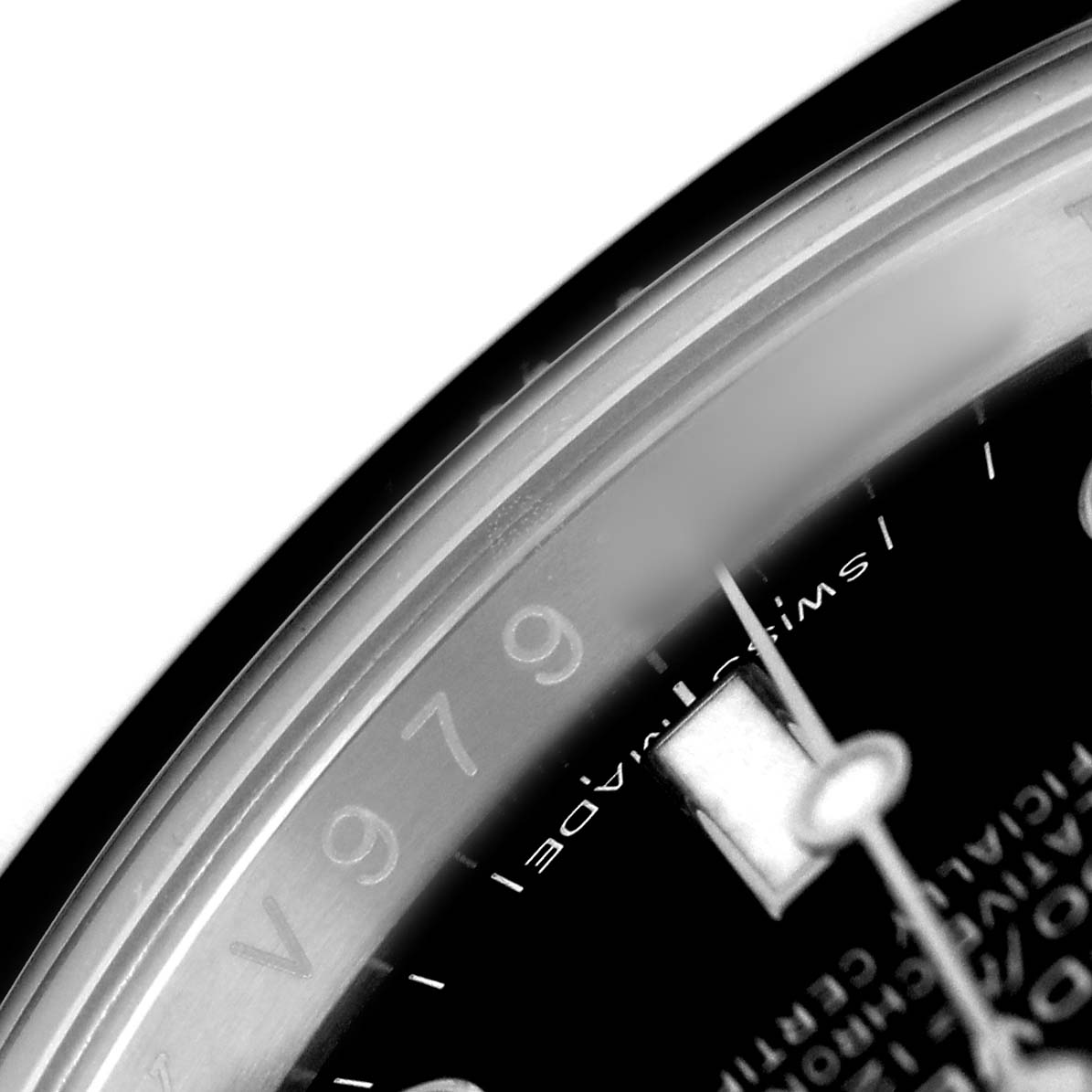 The image shows a close-up of the dial and bezel of a Rolex Sea-Dweller 116600 Men's Stainless Steel Black Dial, highlighting the indices and text.