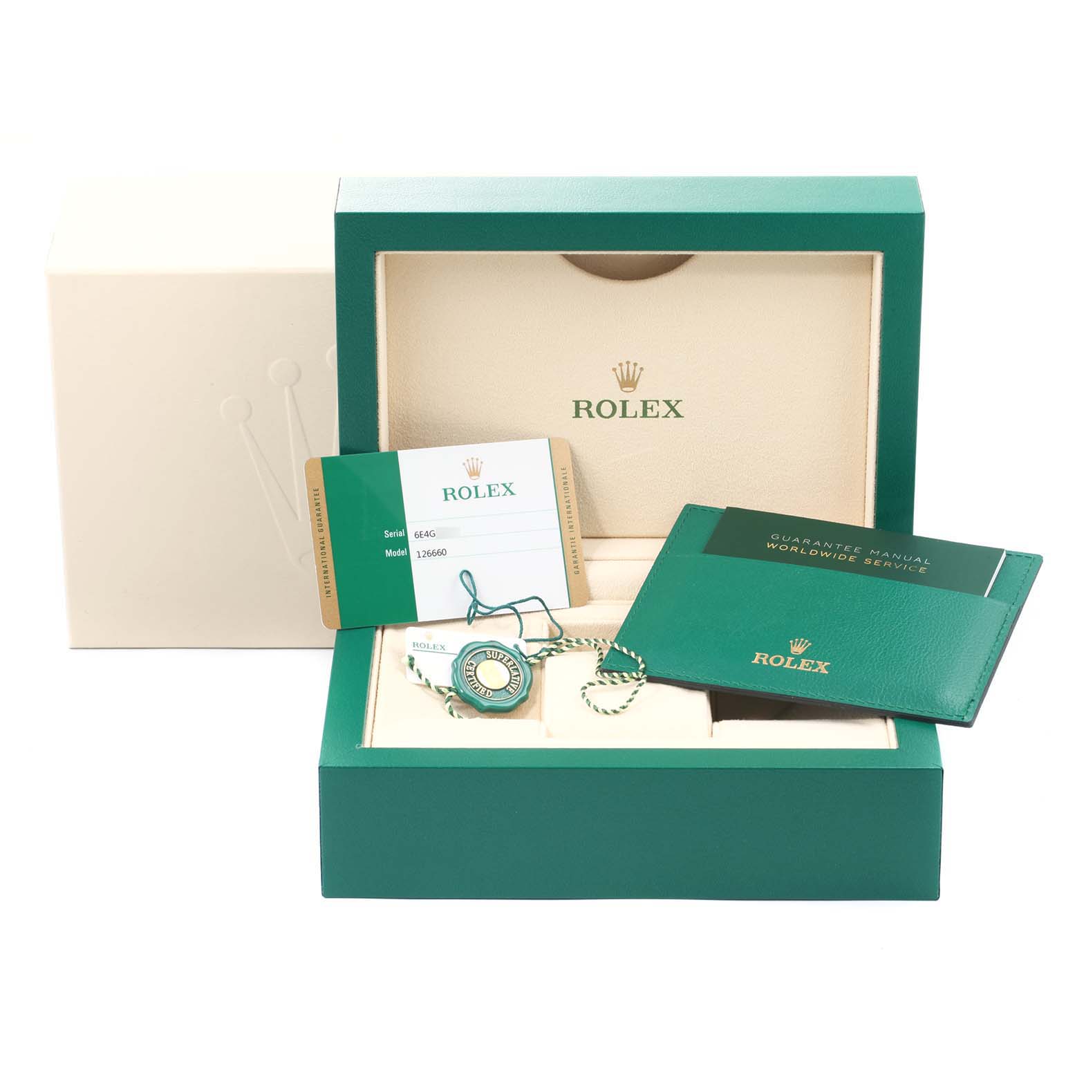 The image shows the packaging, warranty card, manual, and tag of a Rolex Sea-Dweller 2019 Men
s Stainless Steel Blue Dial 2019 Men
s Stainless Steel Blue Dial watch from a frontal angle.