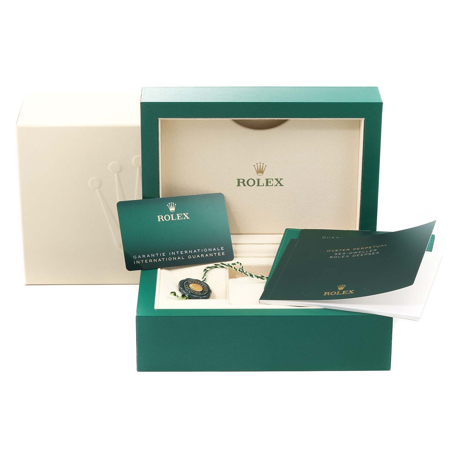 The image shows a Rolex Sea-Dweller 126660 Men
s Stainless Steel Blue Dial 126660 Men
s Stainless Steel Blue Dial watch box, along with international guarantee cards, manuals, and a tag.