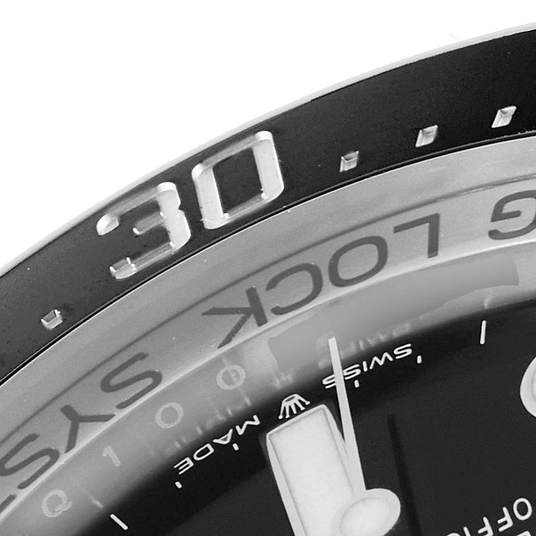 This is a close-up angled shot of the bezel and part of the dial of the Rolex Sea-Dweller 126660 Men
s Stainless Steel Blue Dial 126660 Men
s Stainless Steel Blue Dial watch.