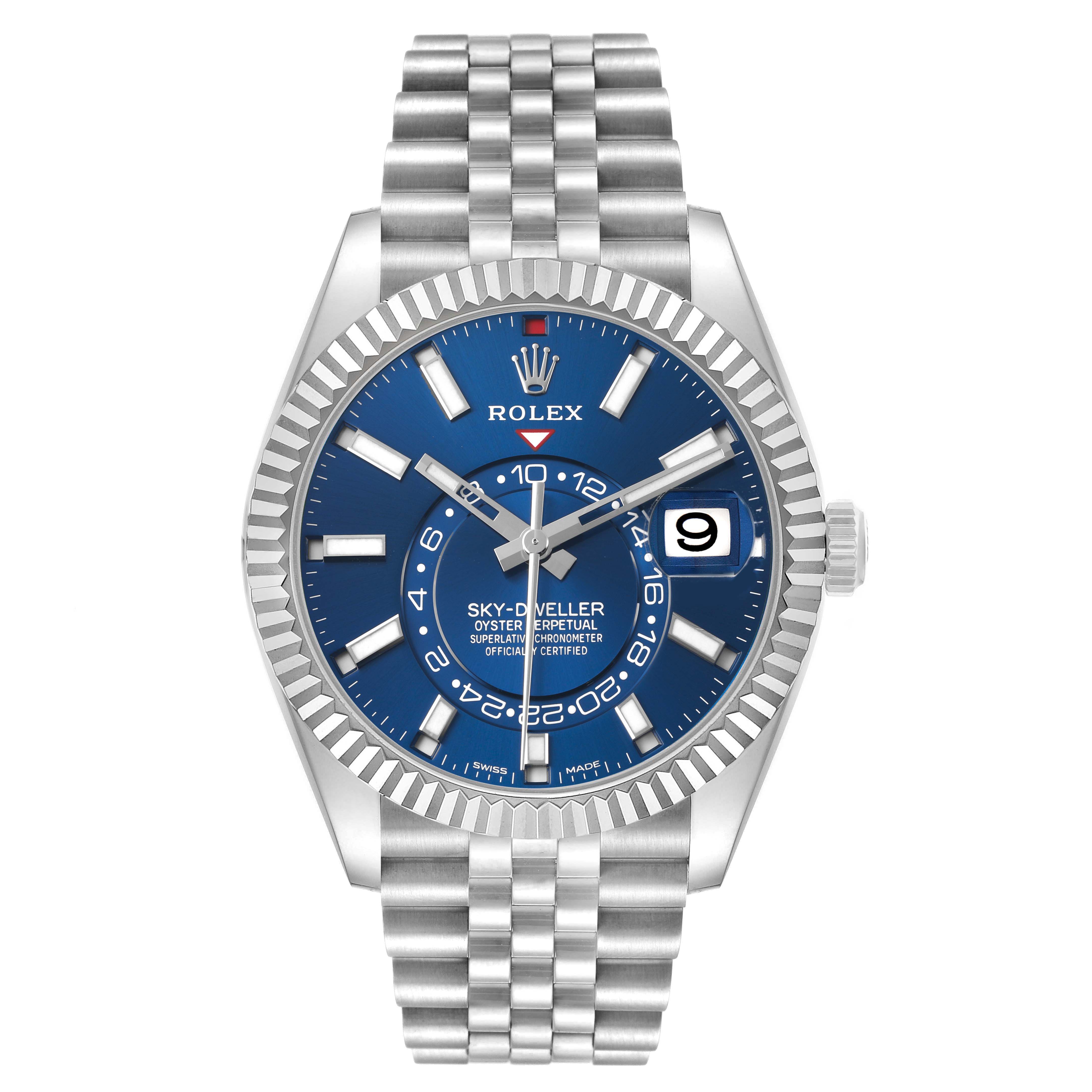 The image shows a front view of a Rolex Sky-Dweller 326934 Men's Stainless Steel Blue Dial watch, highlighting its blue dial, fluted bezel, and Jubilee bracelet.