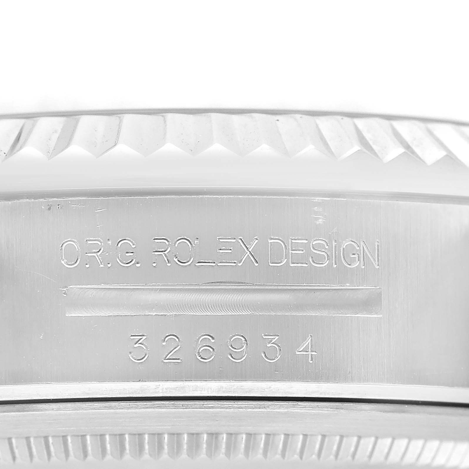 The image shows the side of the Rolex Sky-Dweller 326934 Men's Stainless Steel Blue Dial watch case with engravings of the design name and model number.