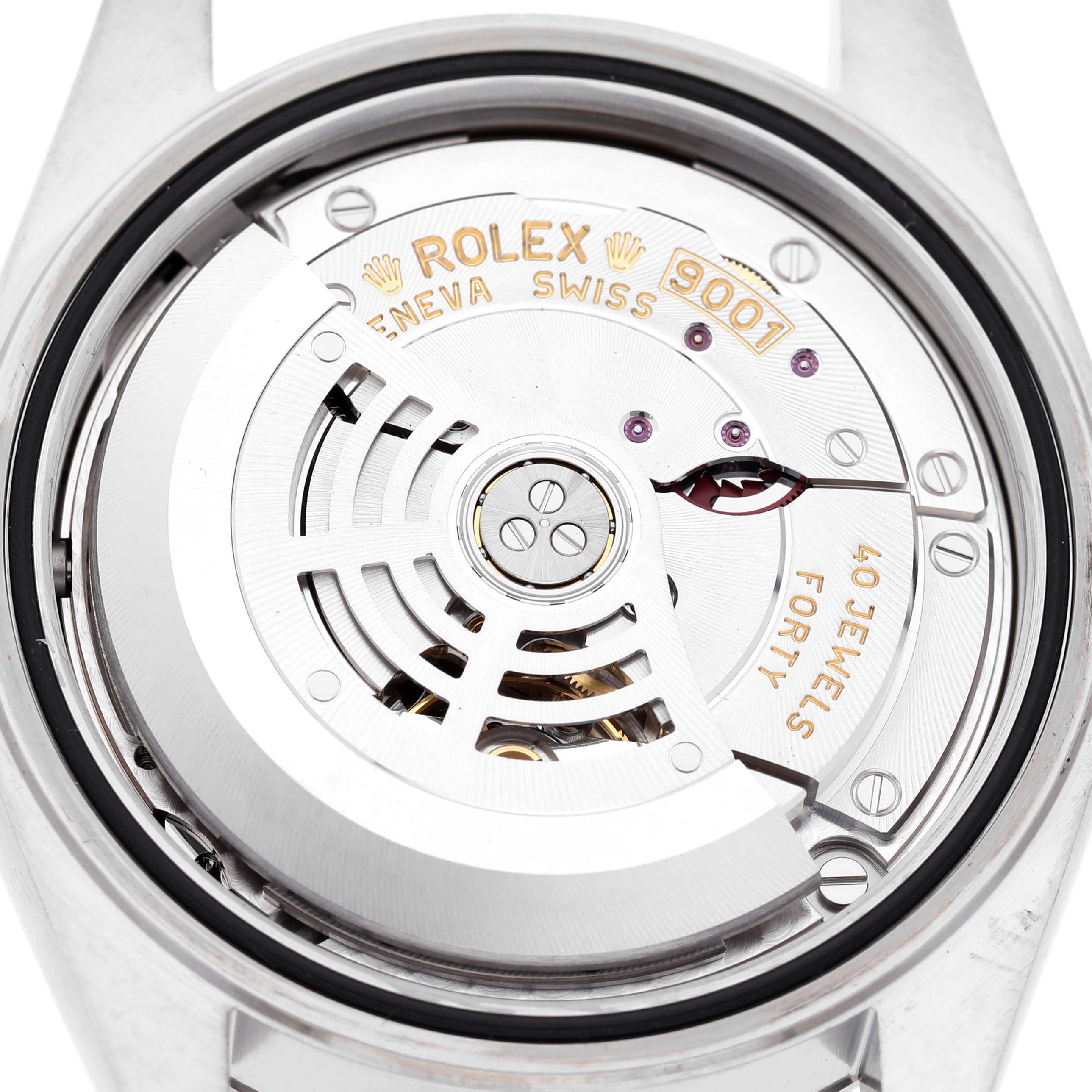 The image shows the movement of a Rolex Sky-Dweller 326934 Men's Stainless Steel Blue Dial watch from a top-down angle, highlighting the intricate mechanical parts.