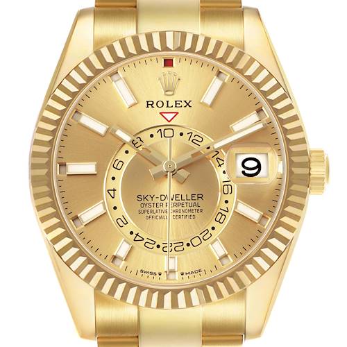 The image shows a front view of a Rolex Sky-Dweller 336938 Mens Yellow Gold Champagne Dial watch, highlighting the dial, date window, and fluted bezel.